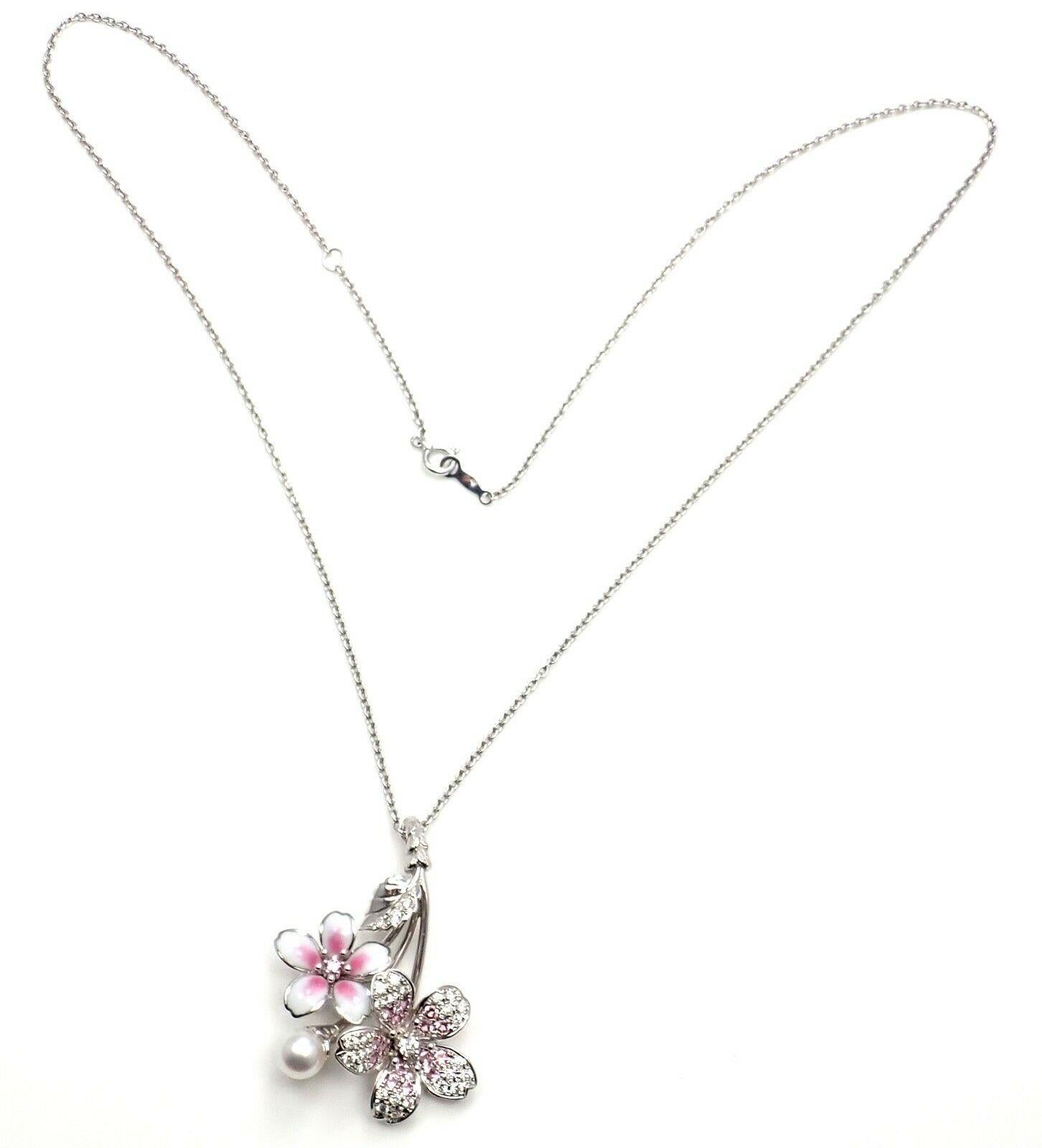 18k White Gold Pink Sapphire Pearl Diamond Sakura Flower Necklace by Mikimoto. 
With Round brilliant cut diamonds
Round Pink Sapphires
1 X 6.5mm Pearl
This necklace comes with Mikimoto Box, Tag & Paper
Details: 
Length: 19.5