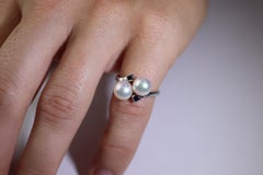 Mikimoto Sapphire Pearl Ring. 14k Mikimoto Sapphire Twin Pearl Bypass band.