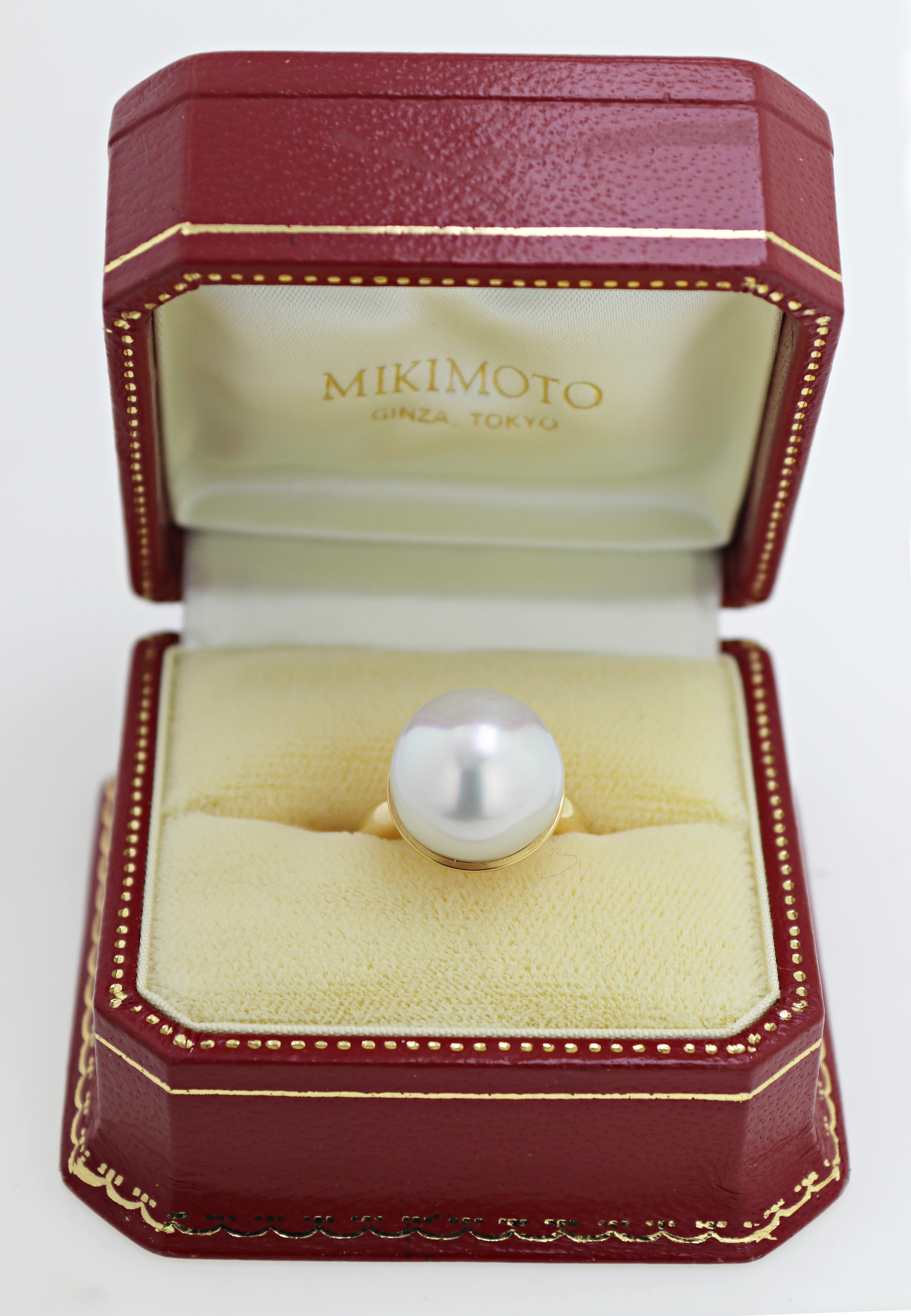 Featuring (1) 14.6 mm South Sea cultured pearl, set in an 18k yellow gold
mounting, marked MIKIMOTO K18, size 6, with original Mikimoto box,
Gross Weight: 13.25 grams.