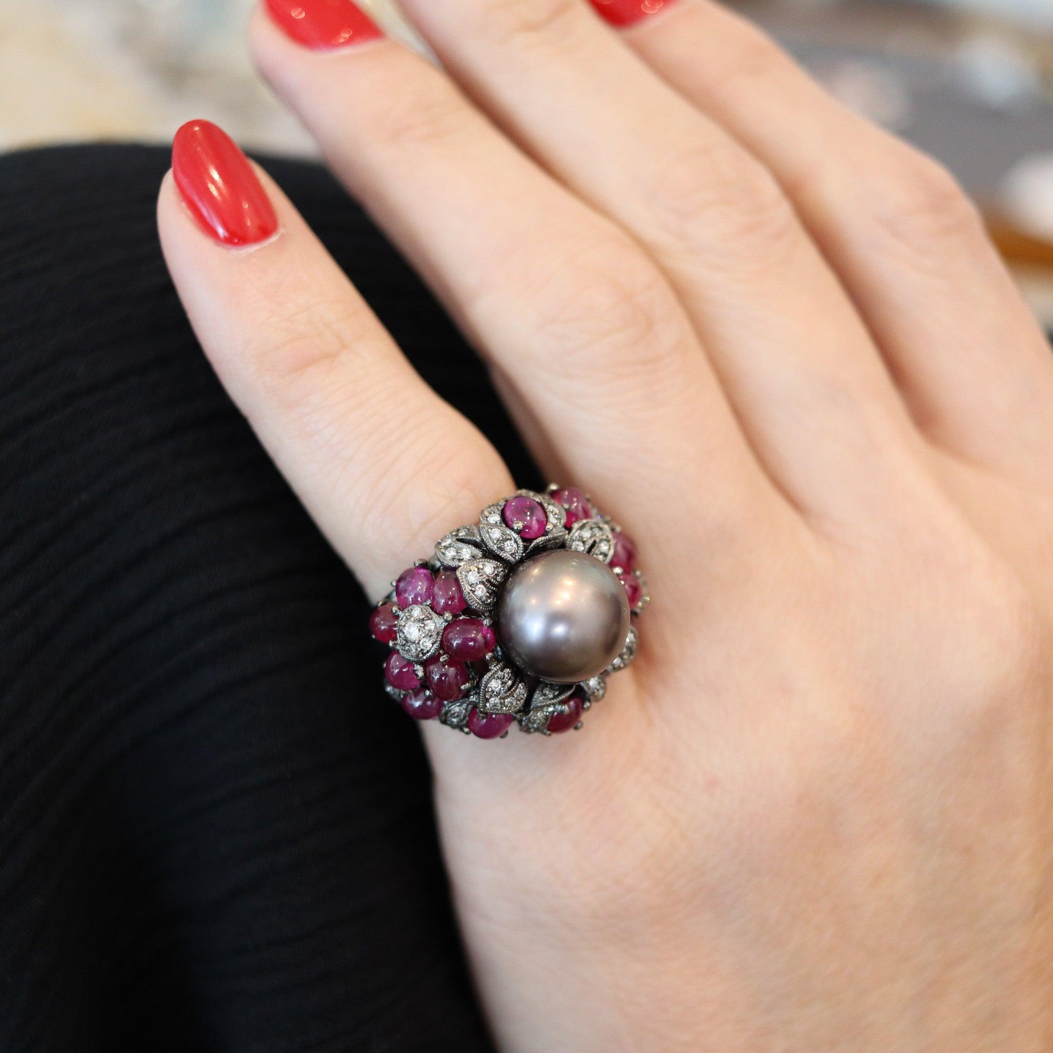 A cocktail ring designed by Mikimoto.

This is a fabulous cocktail ring created in Japan by the jewelry company of Mikimoto. The cocktail ring has been crafted in solid white gold of 18 karats with high polished and black rhodium finishes. It is