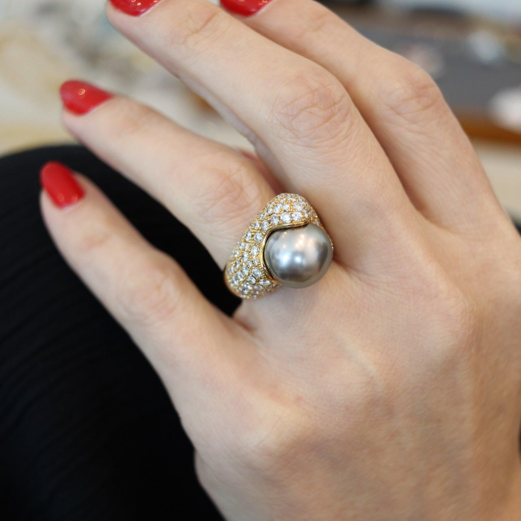 A cocktail ring designed by Mikimoto.

This gorgeous cocktail ring was created in Japan by the jewelry company of Mikimoto. This cocktail ring has been crafted in solid yellow gold of 18 karats with high polished finish. The ring is a real statement