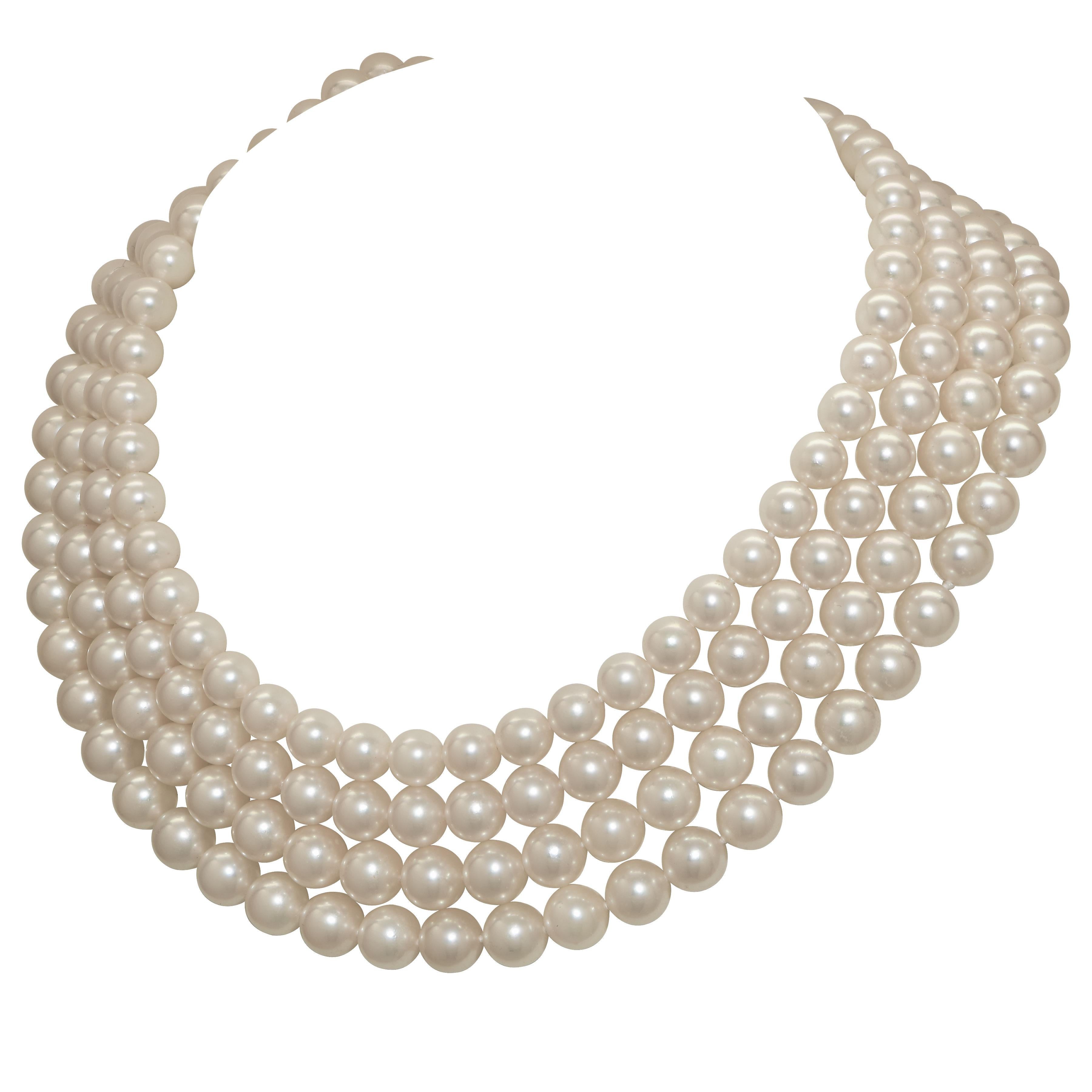 This four-strand Mikimoto Akoya pearl necklace is a masterpiece of elegance and luxury. The layout features four strands of meticulously arranged Akoya pearls,  ranging from 9mm down to 7.5mm, creating a graceful tapering effect that accentuates the