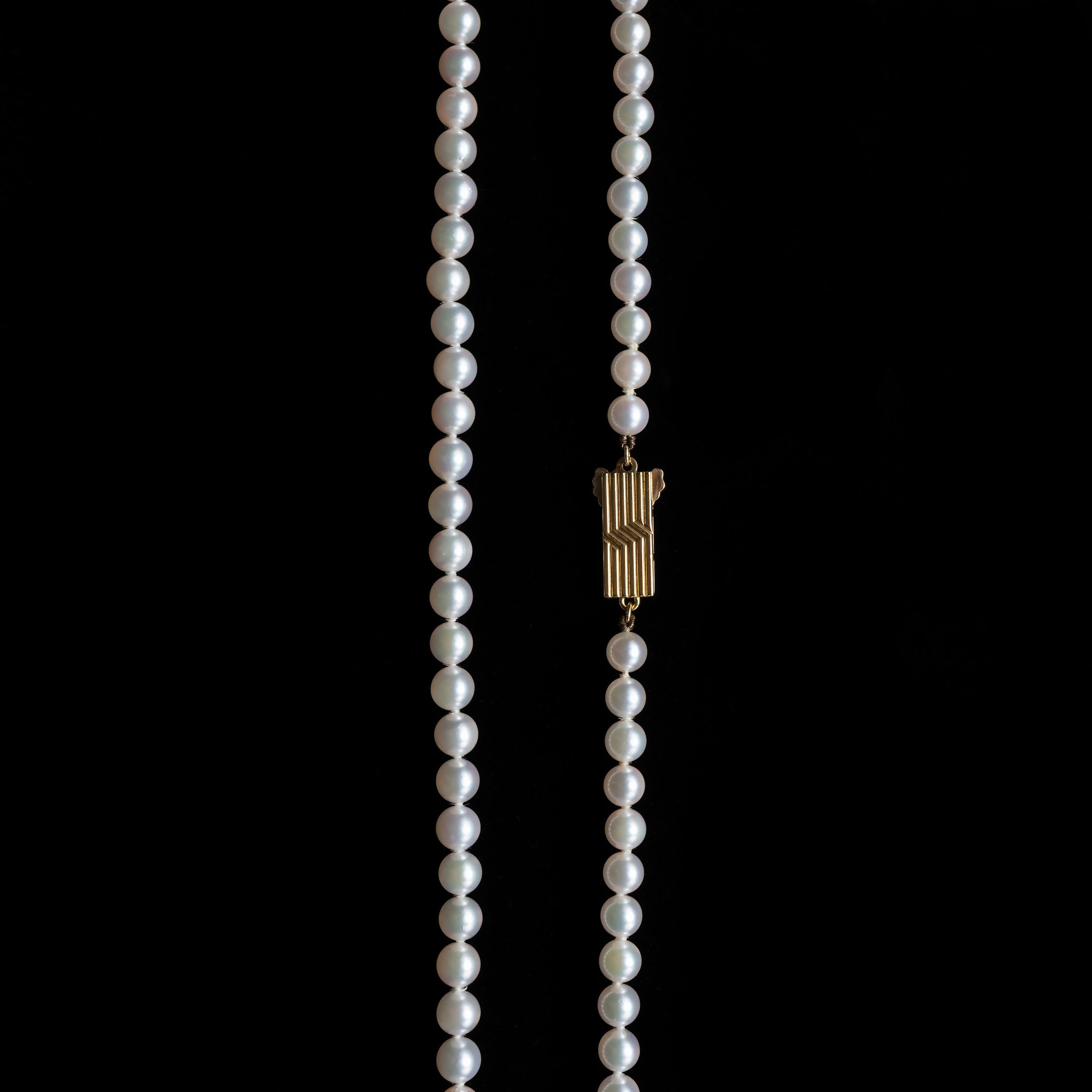 This vintage 1970s-1980s strand of cultured Akoya pearls by Mikimoto represents the zenith of the Japanese jeweler's pearl culturing artistry. With a gentle graduation in size from 5.05mm to 5.41mm, these magnificent pearls display a gleaming