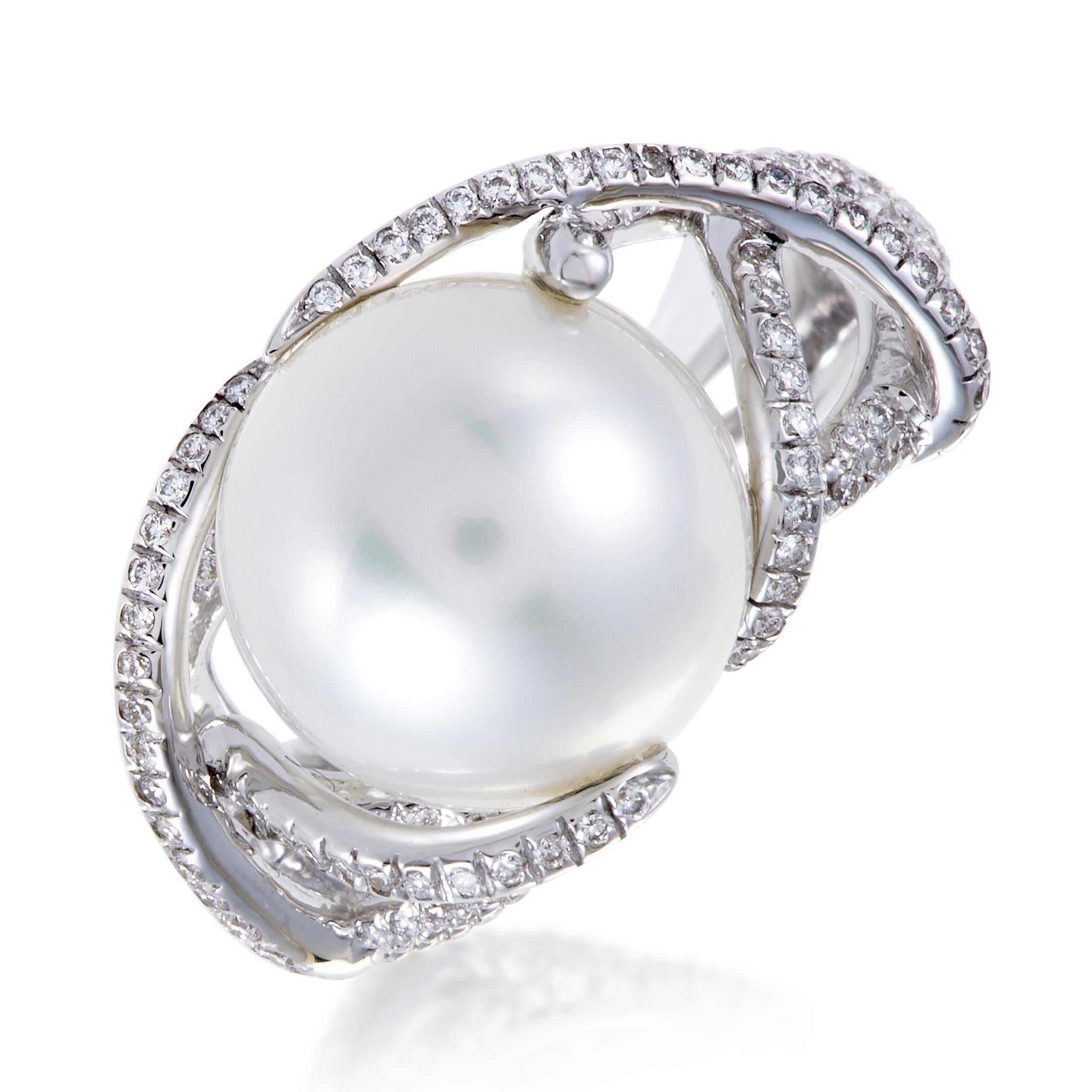 Interplaying in a wonderful manner and gracefully slithering towards and around the angelic pearl, slim strings of 18K white gold are embellished with glistening diamonds weighing in total 0.51ct in this magnificent ring from Mikimoto. Ring Top