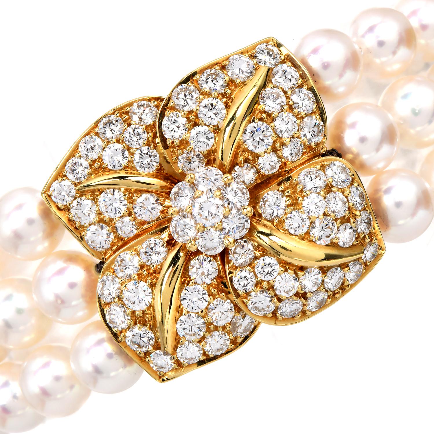 The three-row Mikimoto bracelet features three 18K yellow gold bars designed to hold the strands and a stunning floral clasp, adorned with 49 natural diamonds totaling 4.00  carats,  VS clarity, and F-G color, creating a sparkling focal point,