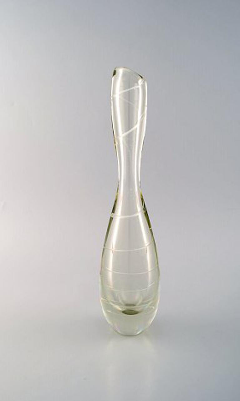 Mikko Helander for Humppila Lasi, finnish art glass, spiral decorated vase. 1960's.
Signed: Helander.
Measures: 31 x 8 cm.
In very good condition.