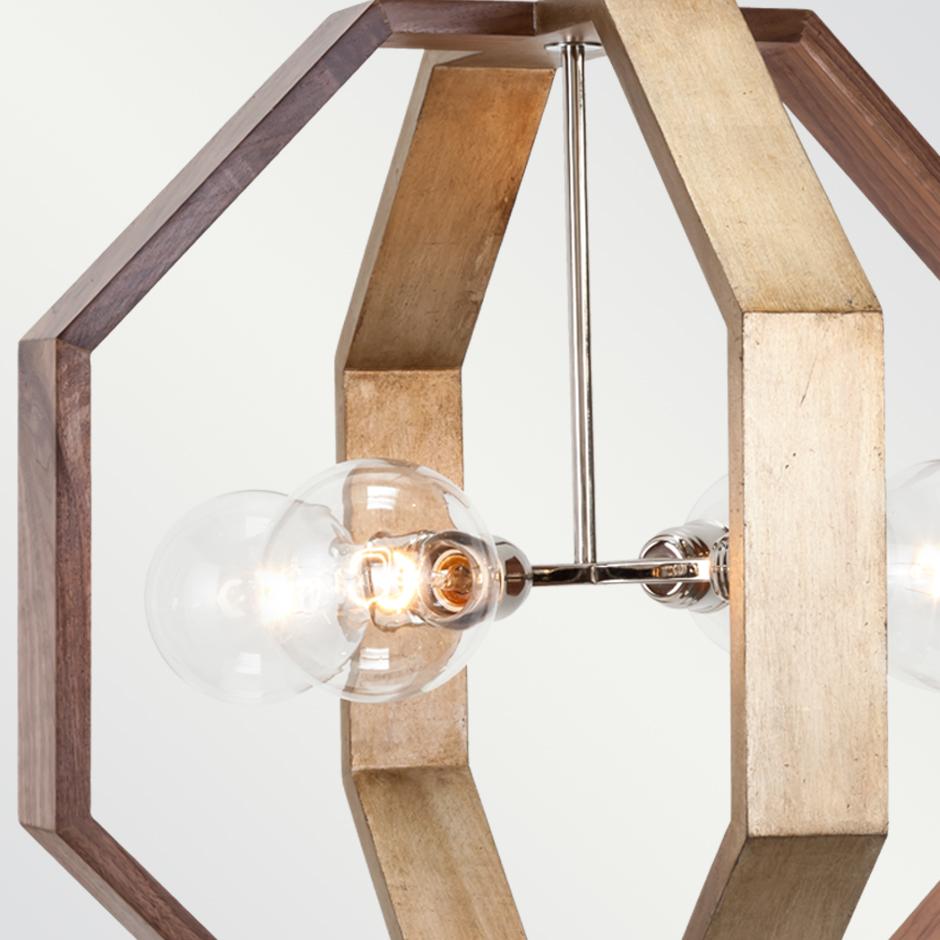 MILA CHANDELIER - Modern Octagonal Walnut and Gold Leaf Chandelier 

The Mila Chandelier is a modern and elegant lighting fixture that features an octagonal design. Its sleek and sophisticated look makes it a perfect addition to any contemporary