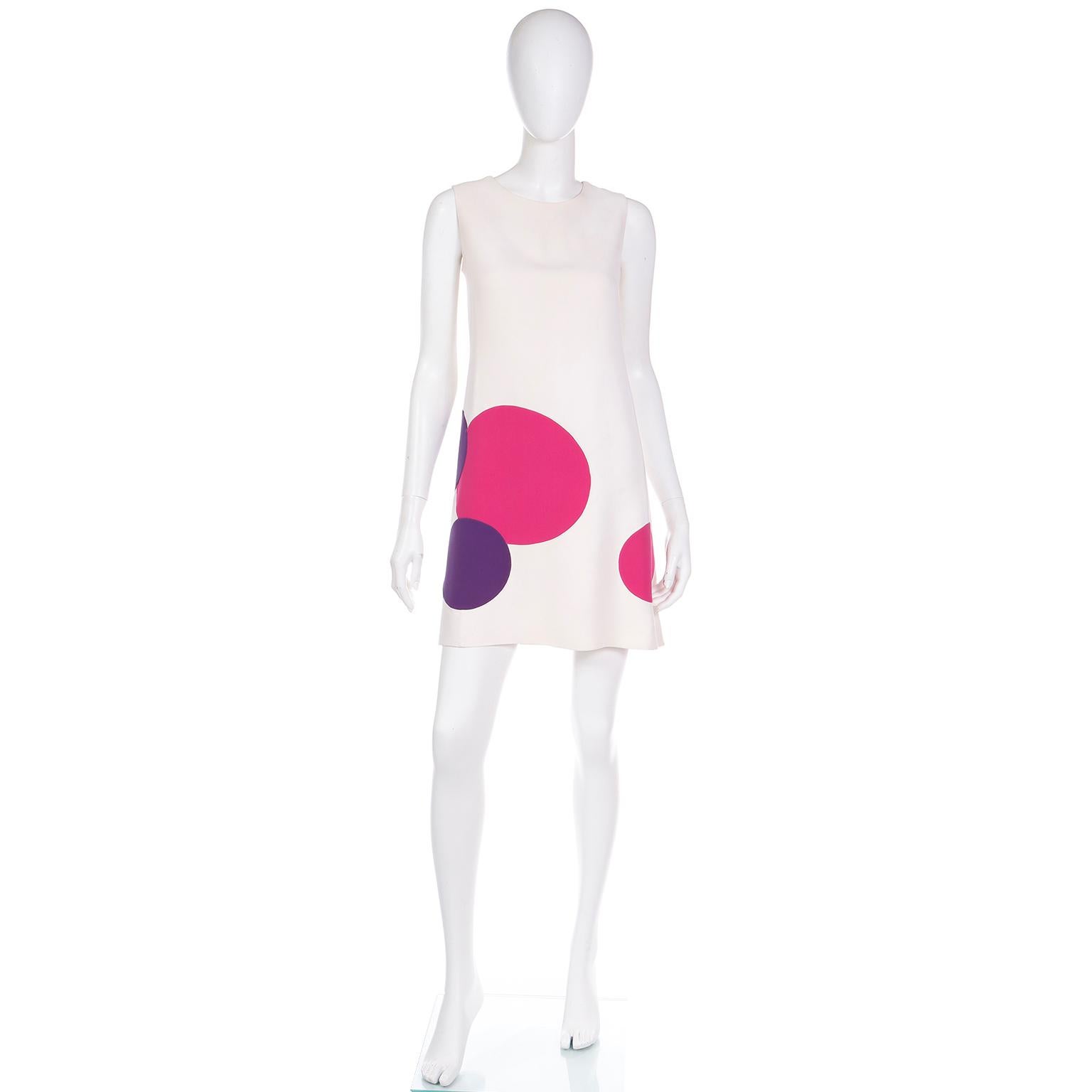 This is a rare vintage 1970's Mila Schon creamy ivory shift dress with giant pink and purple circles or dots. This medium weight double faced silk dress is sleeveless with a round neckline and it closes with a centered back zipper. This is such a