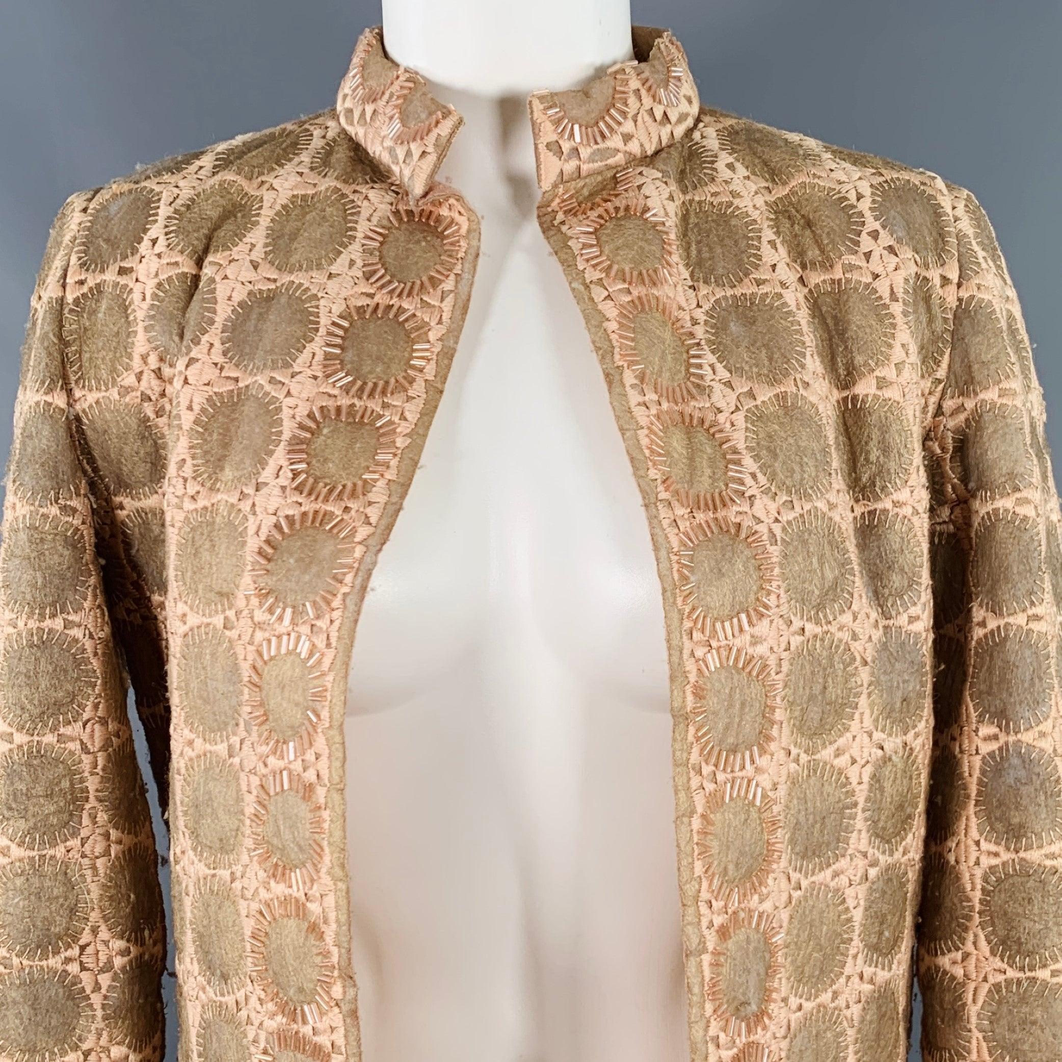 Abrigo vintage MILA SCHON
en poliéster beige y tostado con estampado de círculos, detalles de cuentas y parte delantera abierta. Made in Italy.Buen estado vintage. Pliegues y signos de desgaste moderados propios de la época. Tal cual. 

Marcado:   6