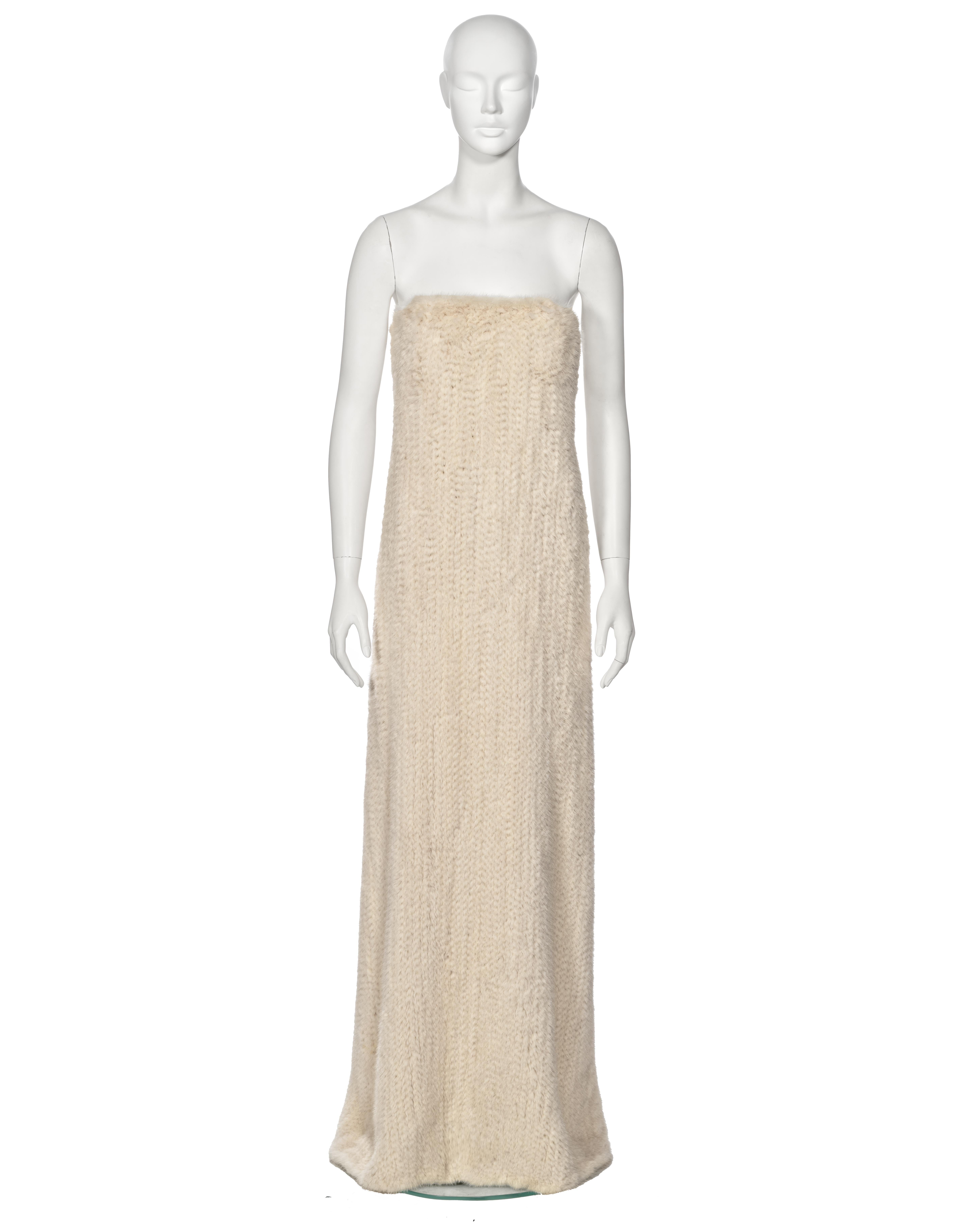 ▪ Mila Schön White Mink Fur Dress
▪ Fall-Winter 1999 Collection
▪ Sold by One of a Kind Archive
▪ Crafted from knitted white mink fur
▪ Strapless bodice featuring built-in support
▪ Elegant floor length
▪ Straight, relaxed silhouette
▪ Side seam zip