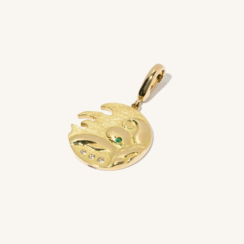 Our Turtle Coin Emerald pendant uses 18 karat gold with varying textures, petite diamonds totaling 0.02 carat, and a single stunning 0.01 carat emerald accent, all of which glisten subtly in the sunlight.

*Please note that this item is made to