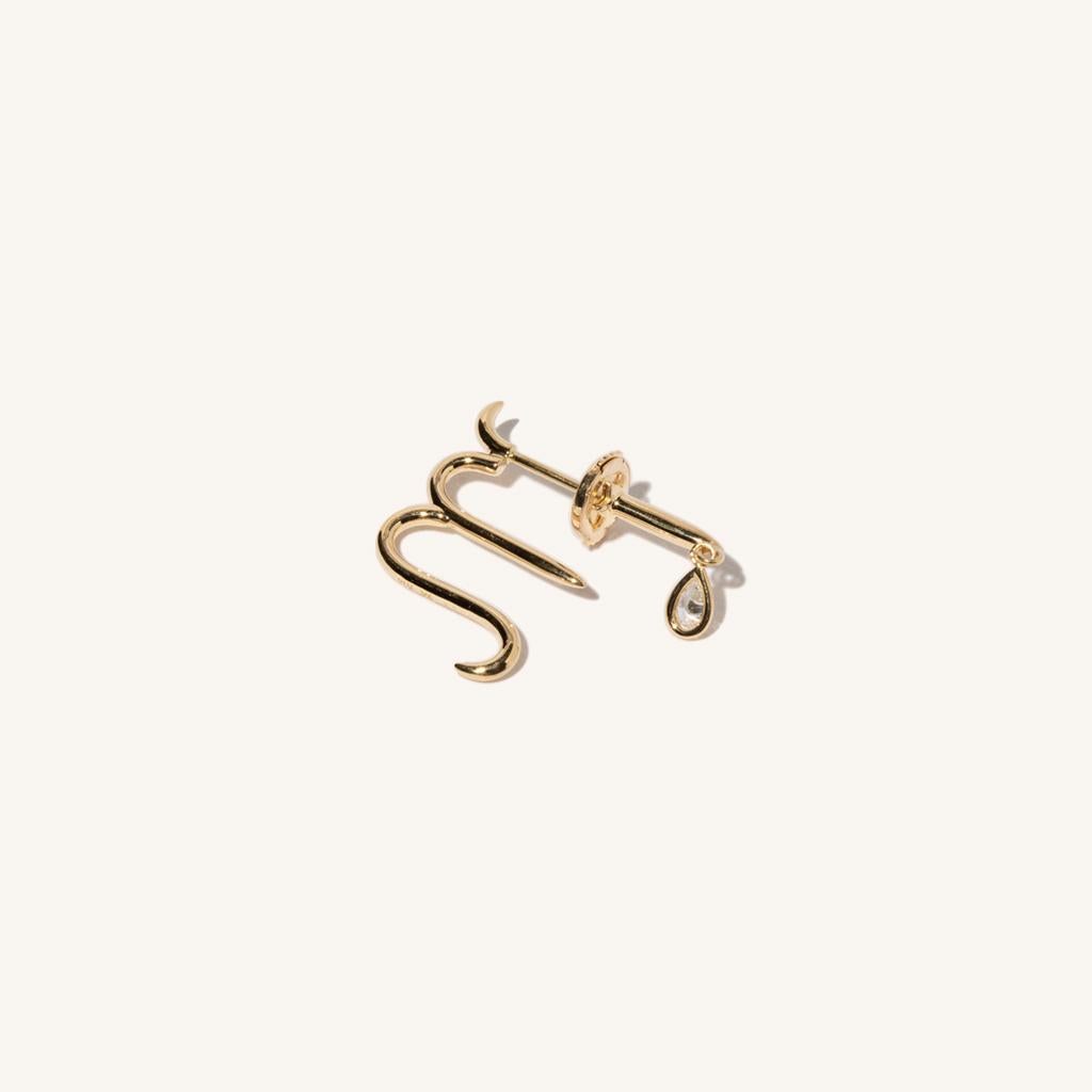 Zodiac inspired items are special items that have long been said to be auspicious. MILAMORE's zodiac motif earrings take form in 18k yellow gold accented with a single sparkling diamond and finished in an abstract shape that looks good on everyone .
