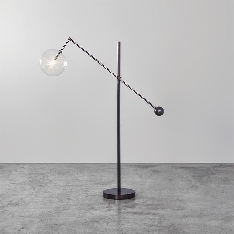 Black Gunmetal 1 arm floor lamp by Schwung
Dimensions: D 113 x W 33.4 x H 170 cm
Materials: Solid brass, hand-blown glass globes
Finish: Black Gunmetal. 
Available in finishes: Natural Brass or Polished Nickel. Also available in Table Lamp.