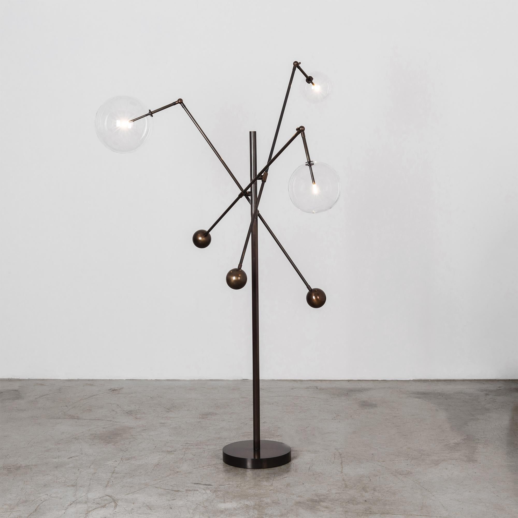 Black Gunmetal 3 arm floor lamp by Schwung
Dimensions: D 124.1 x W 129.3 x H 182.6 cm
Materials: Solid brass, hand-blown glass globes
Finish: Black Gunmetal. 
Available in finishes: Natural Brass or Polished Nickel. Also available in table lamp.