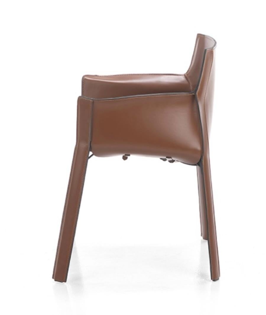 The Milan Armchair is an ideal comfortable dining and or desk chair .  The seat and backrest are lightly padded and covered with full-grain cuoio leather.  The upholstery continues throughout the armchair, on the sides, wrapping around the seat, as