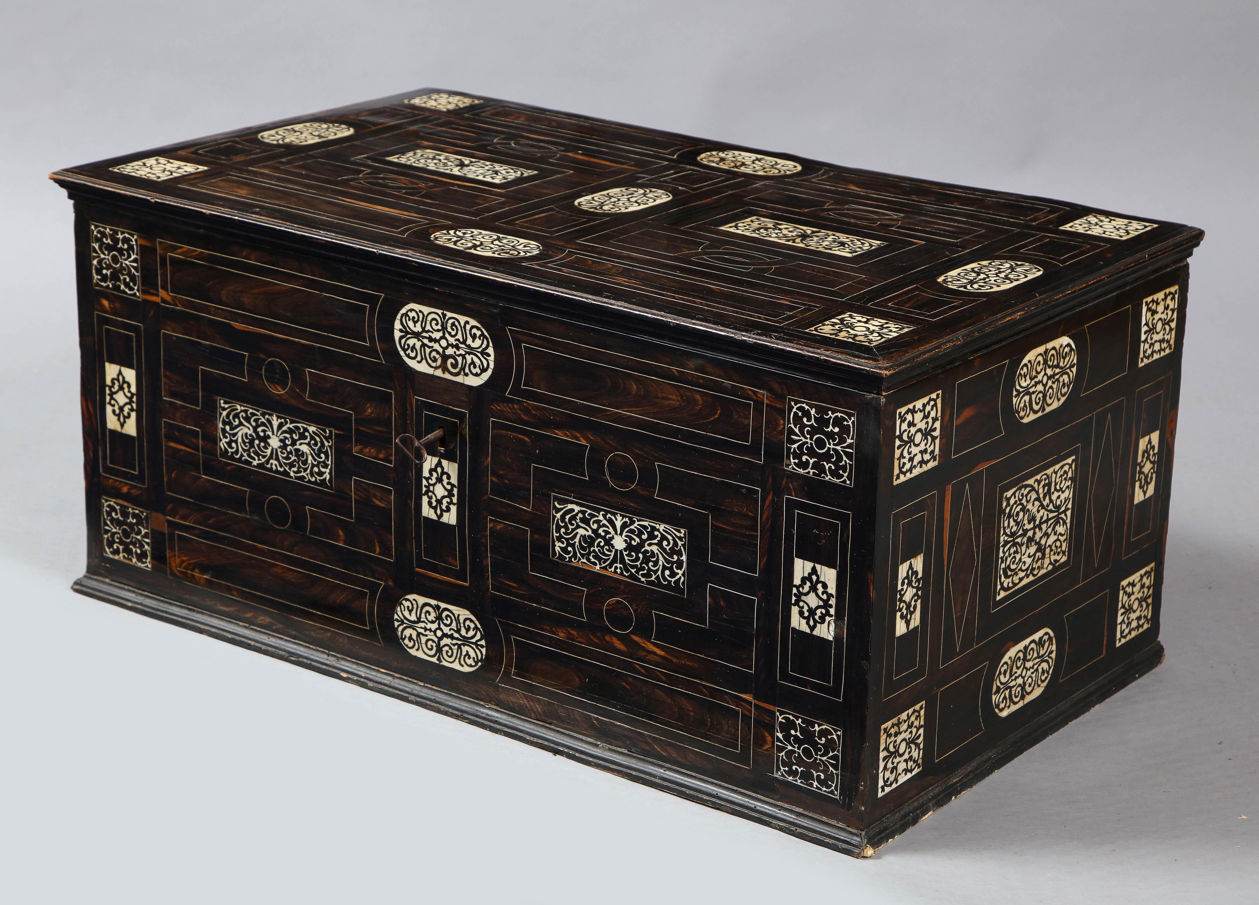 Fine 19th century Italian geometrically inlaid ebony chest with bone string inlay and arabesque inlaid panels, ideal coffee table size, the whole with pleasing surface and patina.