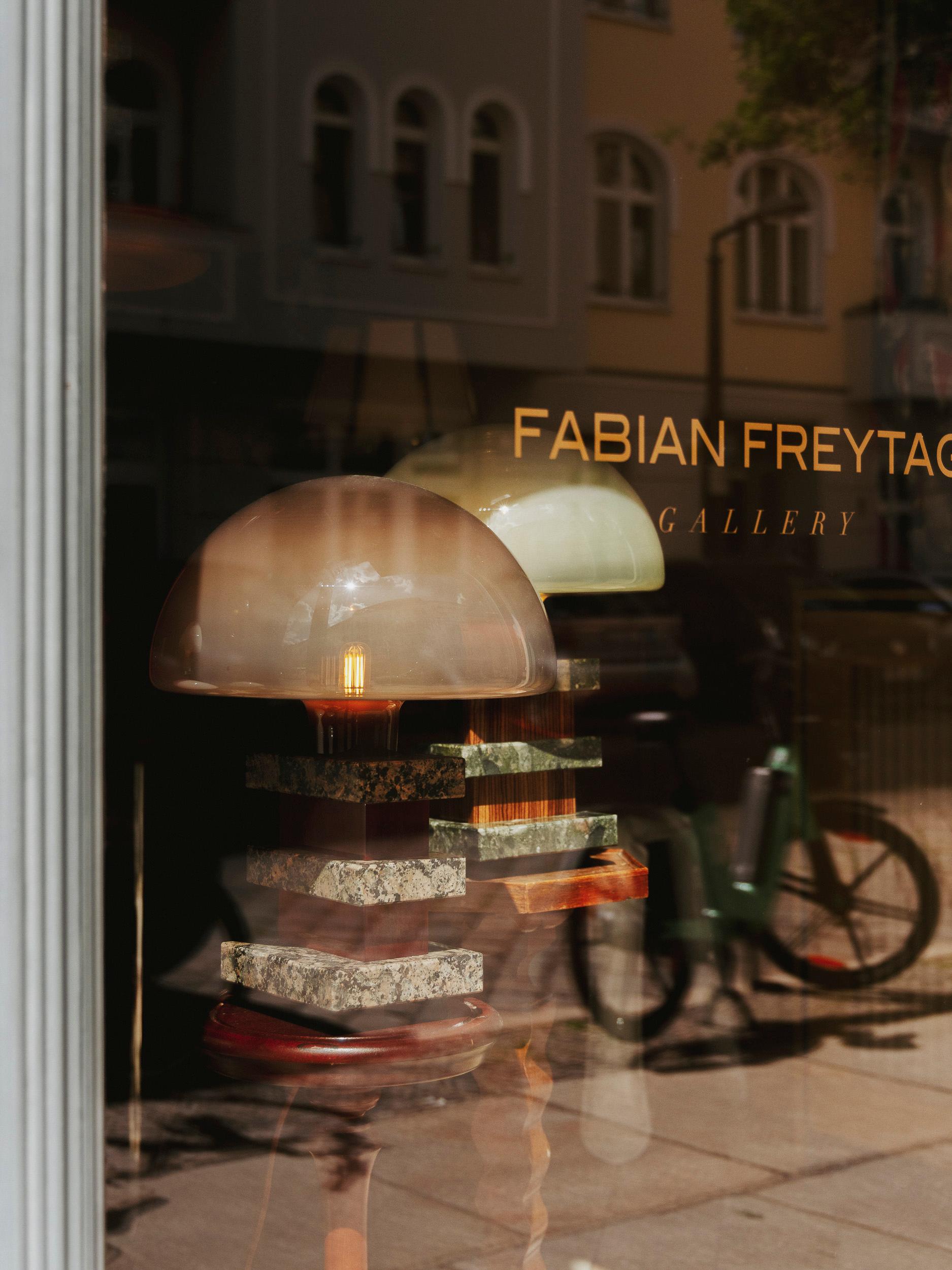 TABLE LAMP MILANO - Limited Borsani Edition 1/7 - No.5

The new table lamp MILANO by Fabian Freytag Studio is a fascinating example of how artificial intelligence and traditional craftsmanship can harmoniously collaborate. The design of the lamp