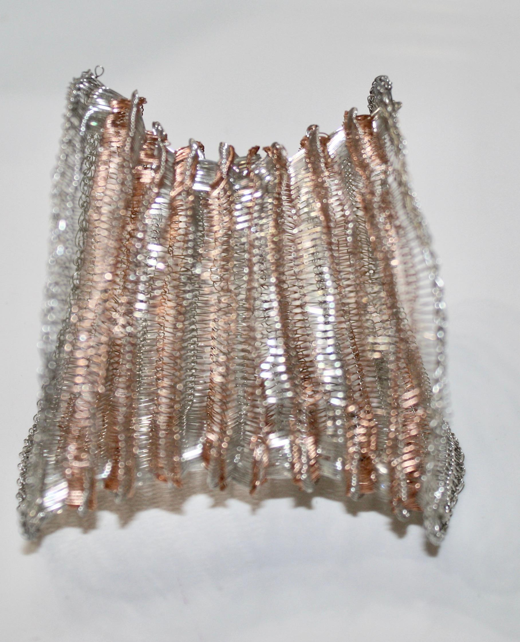 This edgy Milena Zu mesh bracelet is made of fine brass wire which has been partly silver plated and copper.
Italian born Milena Zu, who now resides in Ubud, Bali, works with local crafts people who are masters in an old crocheting technique.