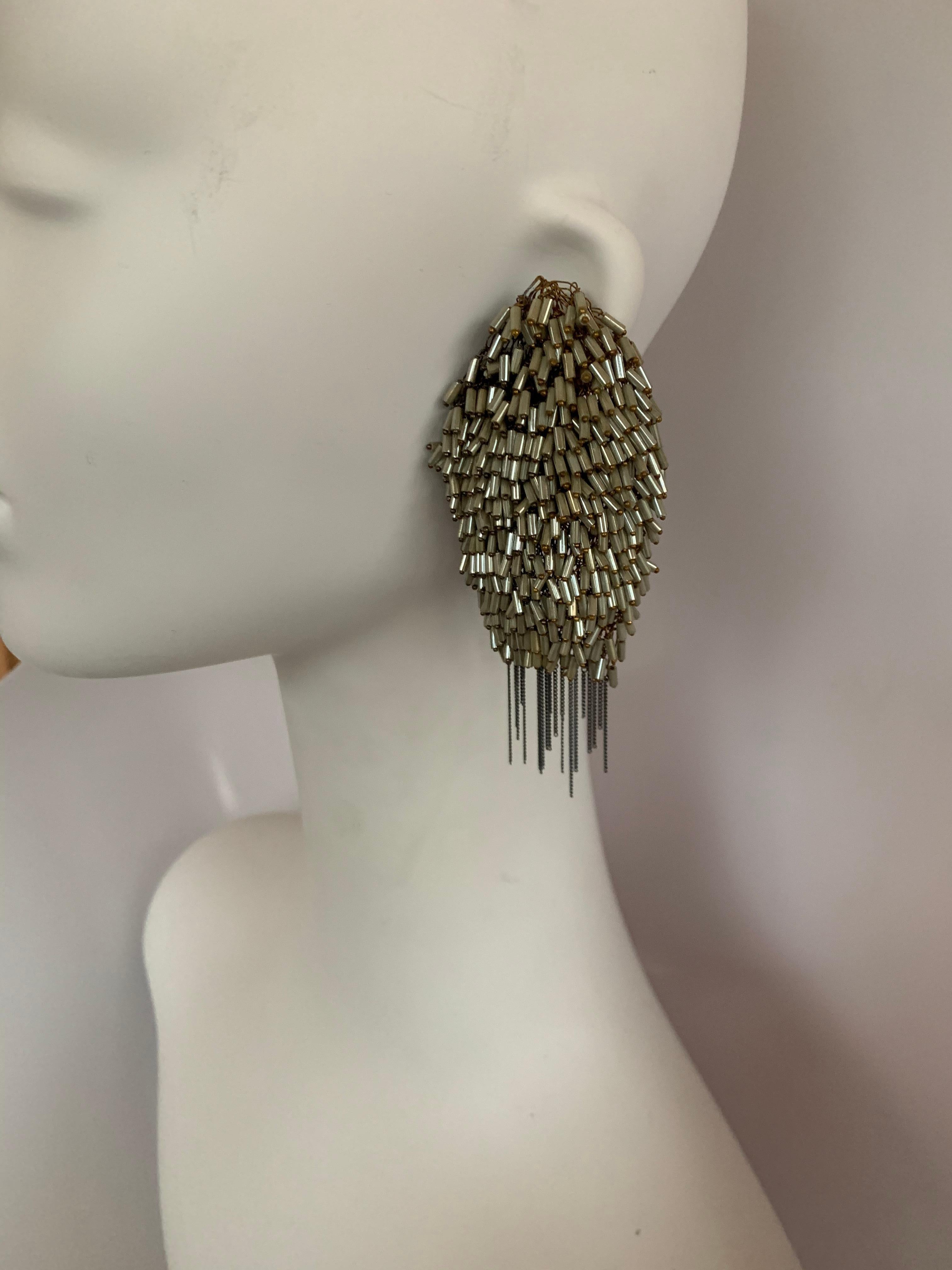 Gorgeous woven metal earrings covered in luxurious beads from Italian designer Milena Zu. 
