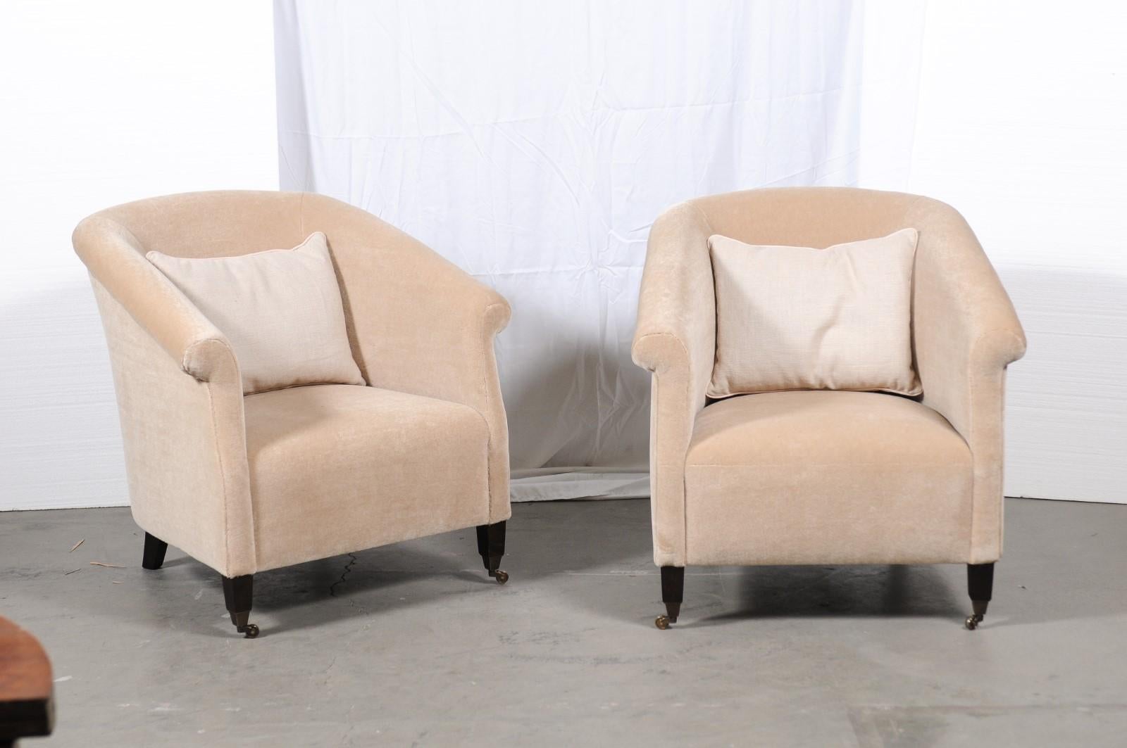 The Miles lounge chairs were made by Tecnoseida (now Bjork) and they are covered in beautiful mohair by Fox Linton Albermarle- 01 Champagne. Tub chairs with a slightly rolled arm and the front feet are on casters.