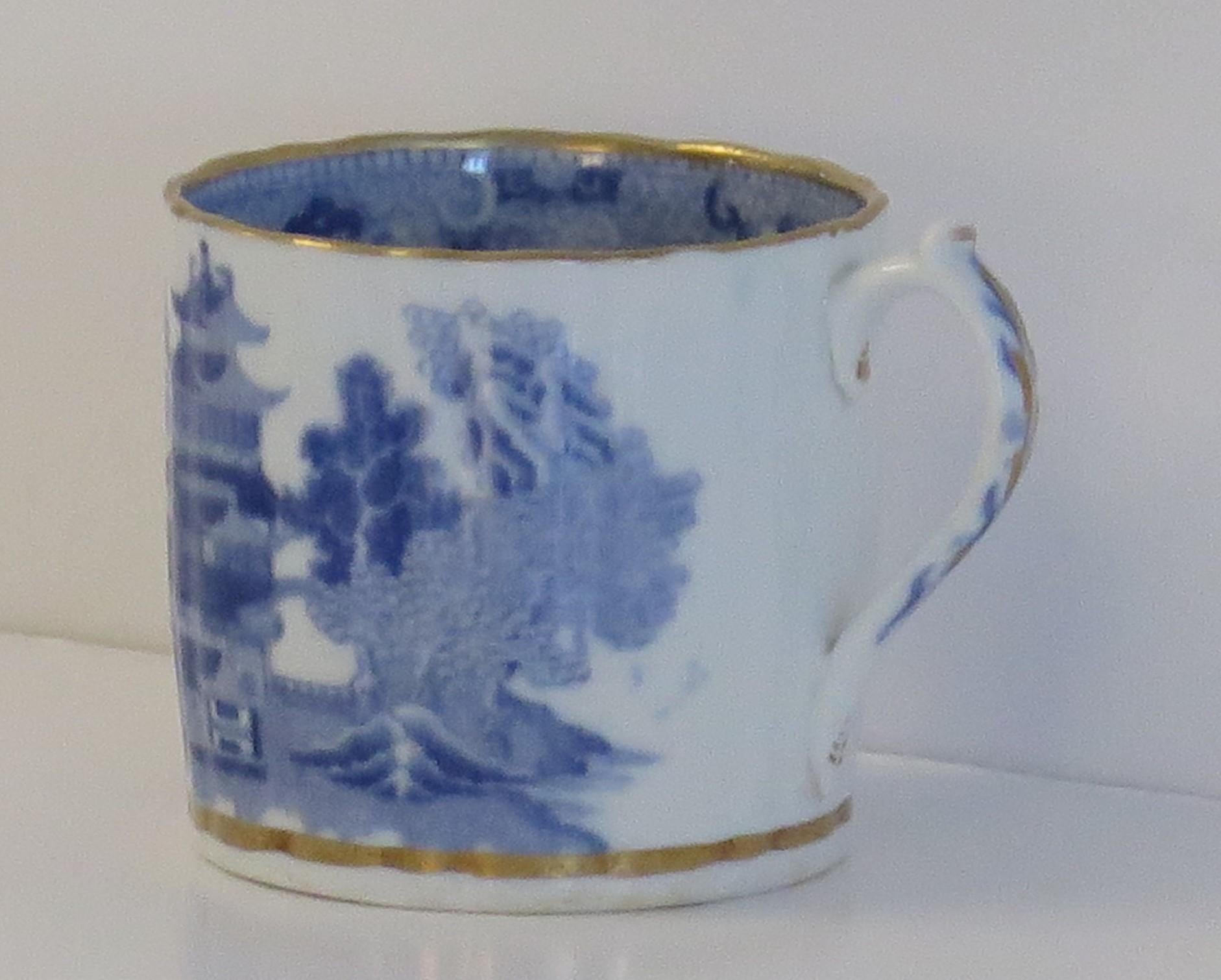 This is a porcelain blue and white, gilded Coffee Can made by Miles Mason (Mason's), Staffordshire Potteries, in the early 19th century George 111rd period, circa 1805-1810.

The piece is well potted with vertical flutes, a slightly wavy rim and