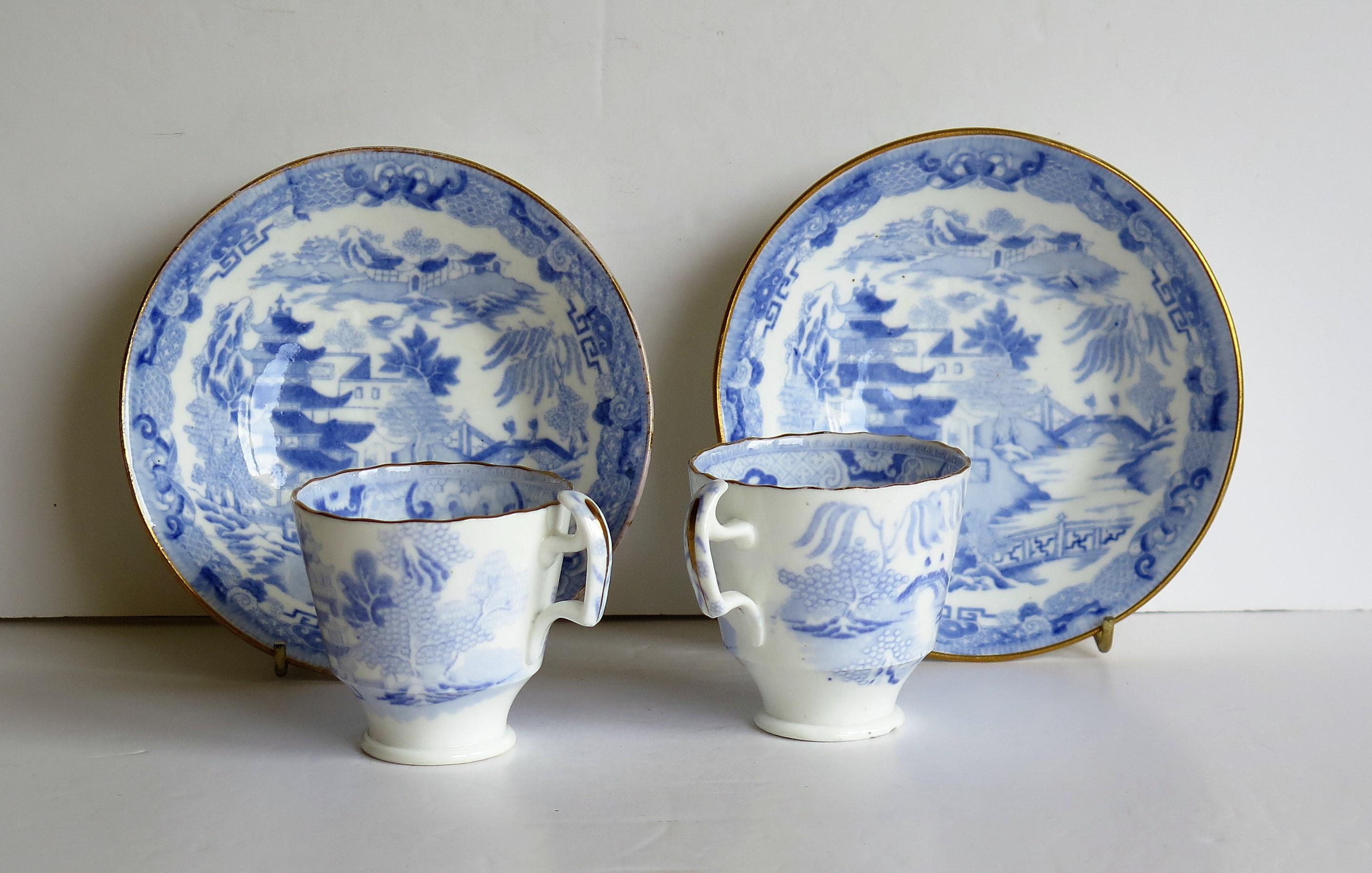 This is a porcelain blue and white, hand gilded pair of coffee cups and saucers made by Miles Mason (Mason's), Staffordshire Potteries, in the early 19th century, circa 1812-1820.

All pieces are well potted with the cups having the 