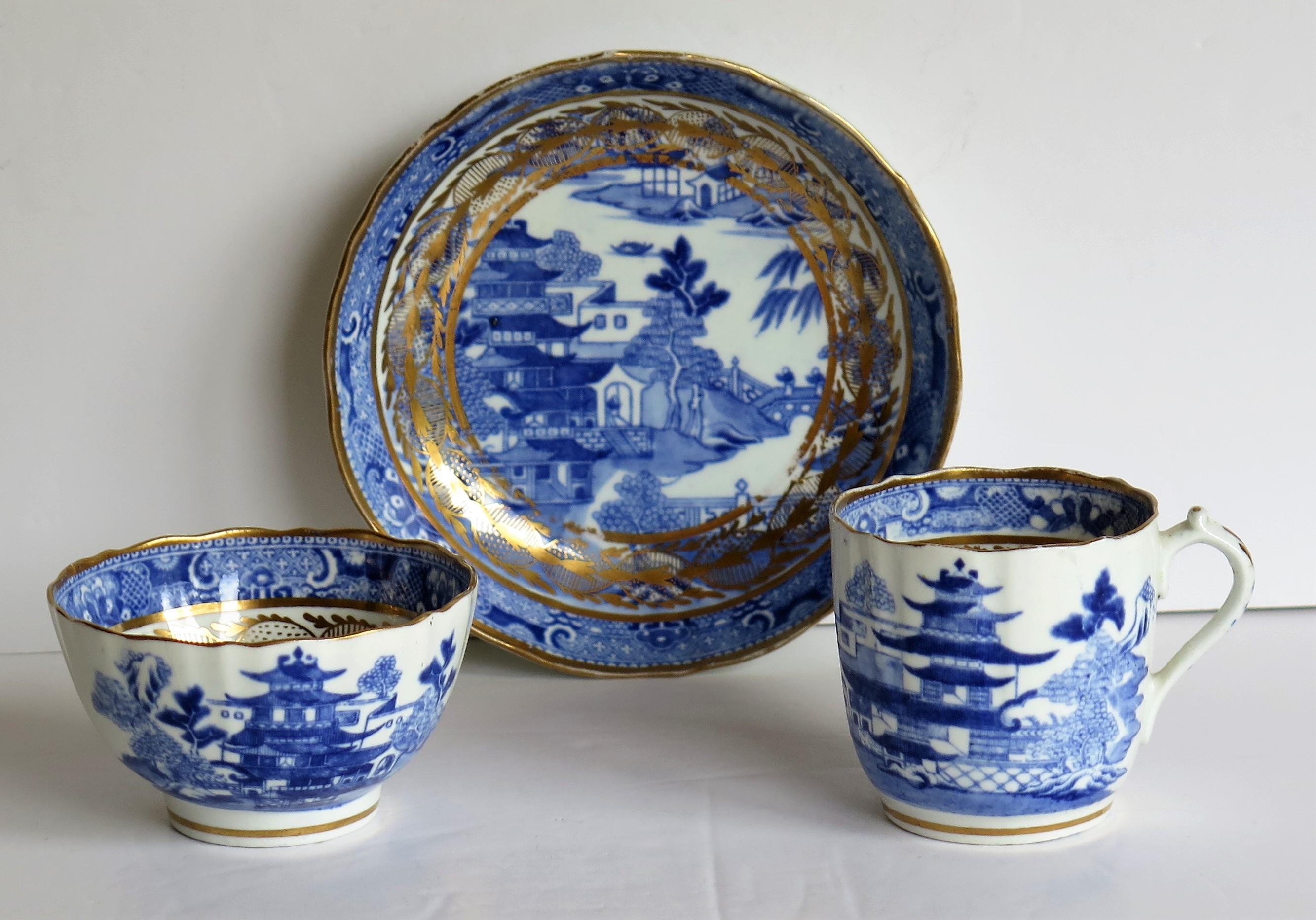 This is a porcelain blue and white, gilded trio comprising a coffee cup, tea bowl and saucer made by Miles Mason (Mason's), Staffordshire Potteries, in the early 19th century George 111rd period, circa 1805-1810.

All pieces are well potted with