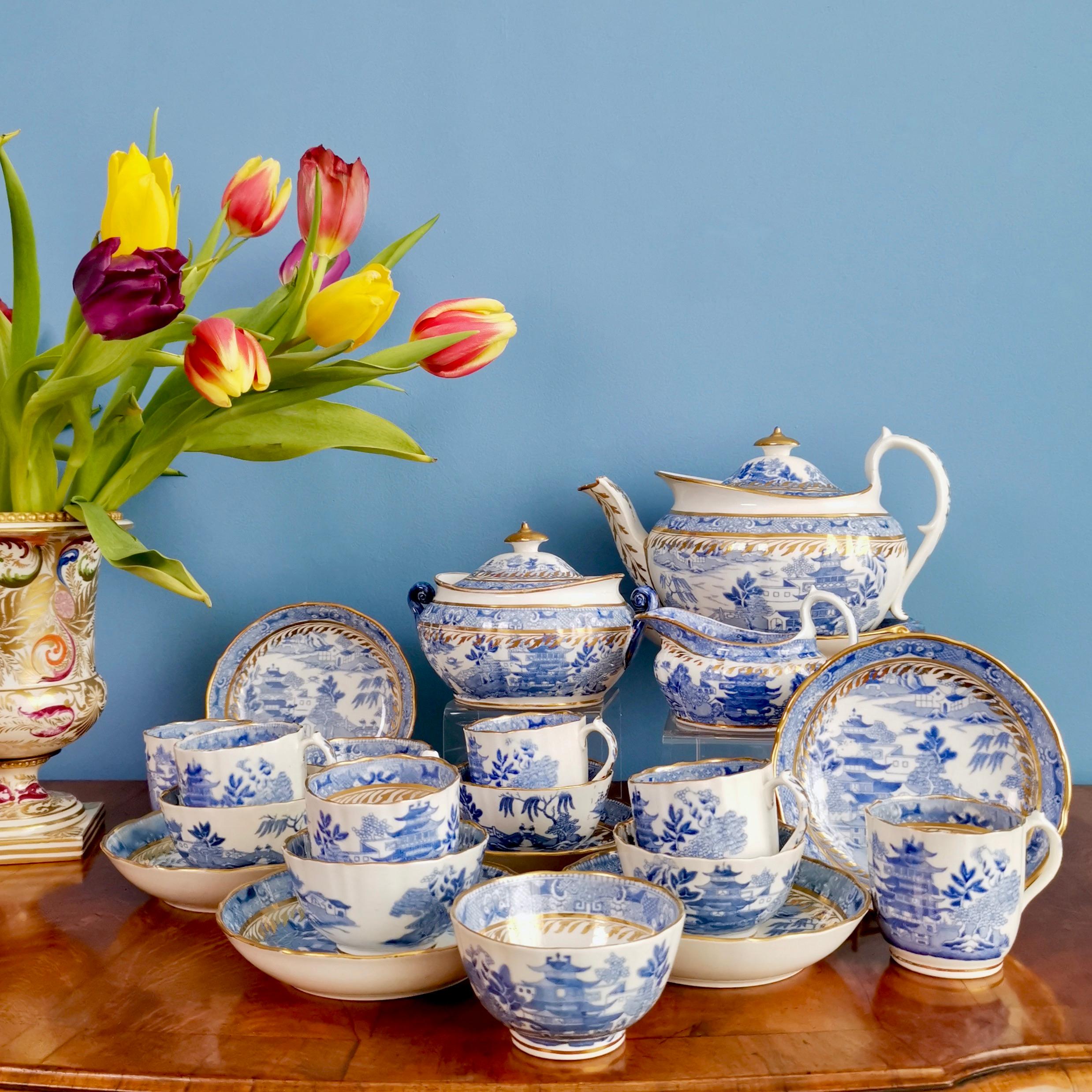 This is a gorgeous full tea service serving six made by Miles Mason circa 1810, which was the Regency era. The items are decorated with the famous Pagoda pattern in blue and white transfer and a gracious gilt detail.

This service has provenance,