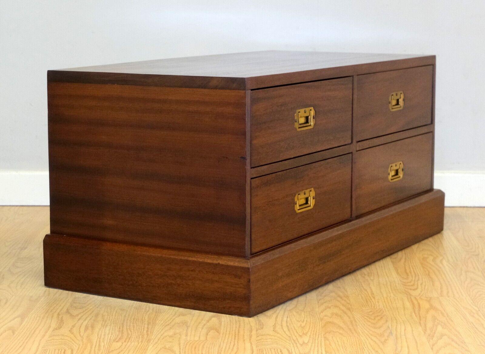 We are delighted to offer for sale this charming Military campaign brown Mahogany chest/tv stand.

This good looking, well made, and decorative piece is proudly presented with four good sized drawers which open smoothly. The rich coloured brass
