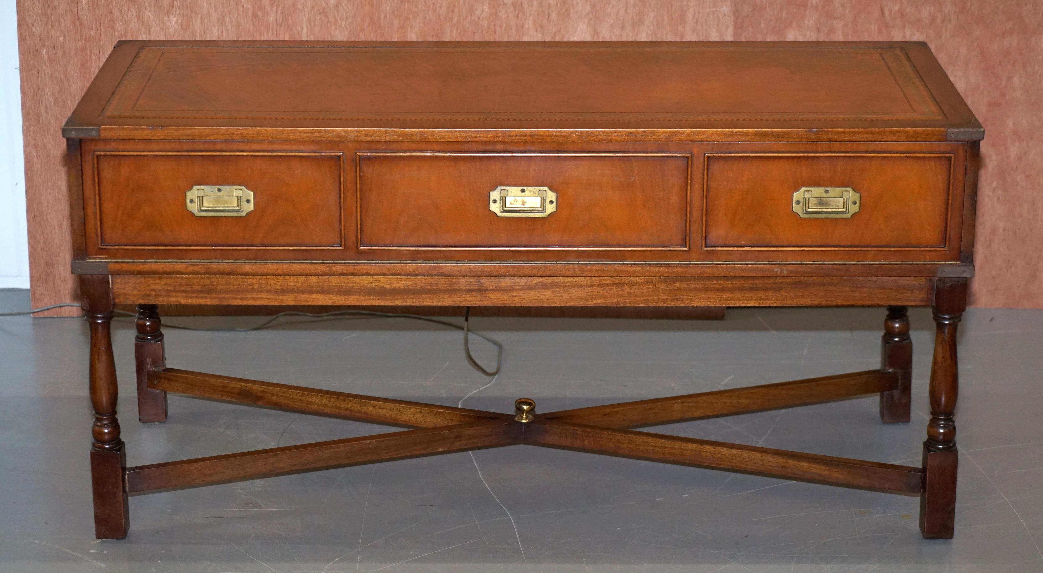 We are delighted to this lovely vintage circa 1970s impulse ST 210 Radiogram Military Campaign brown leather topped console table

What a cool thing, on the outside you have the never out of style military Campaign style console table, it’s the