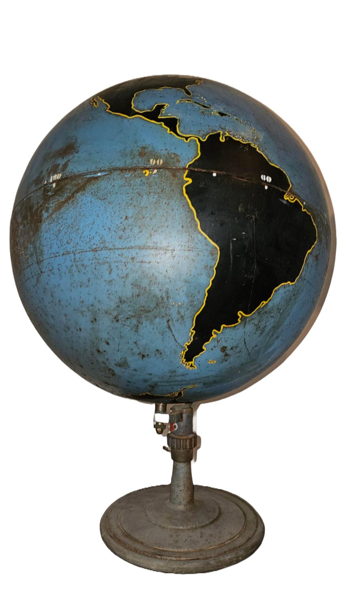 Crafted by the renowned Denoyer-Geppert Company between the 1940s and 1950s, this Machine Age-style military planning globe is an exceptional example of mid-century design and functionality. The globe features a 20-inch spun metal orb with