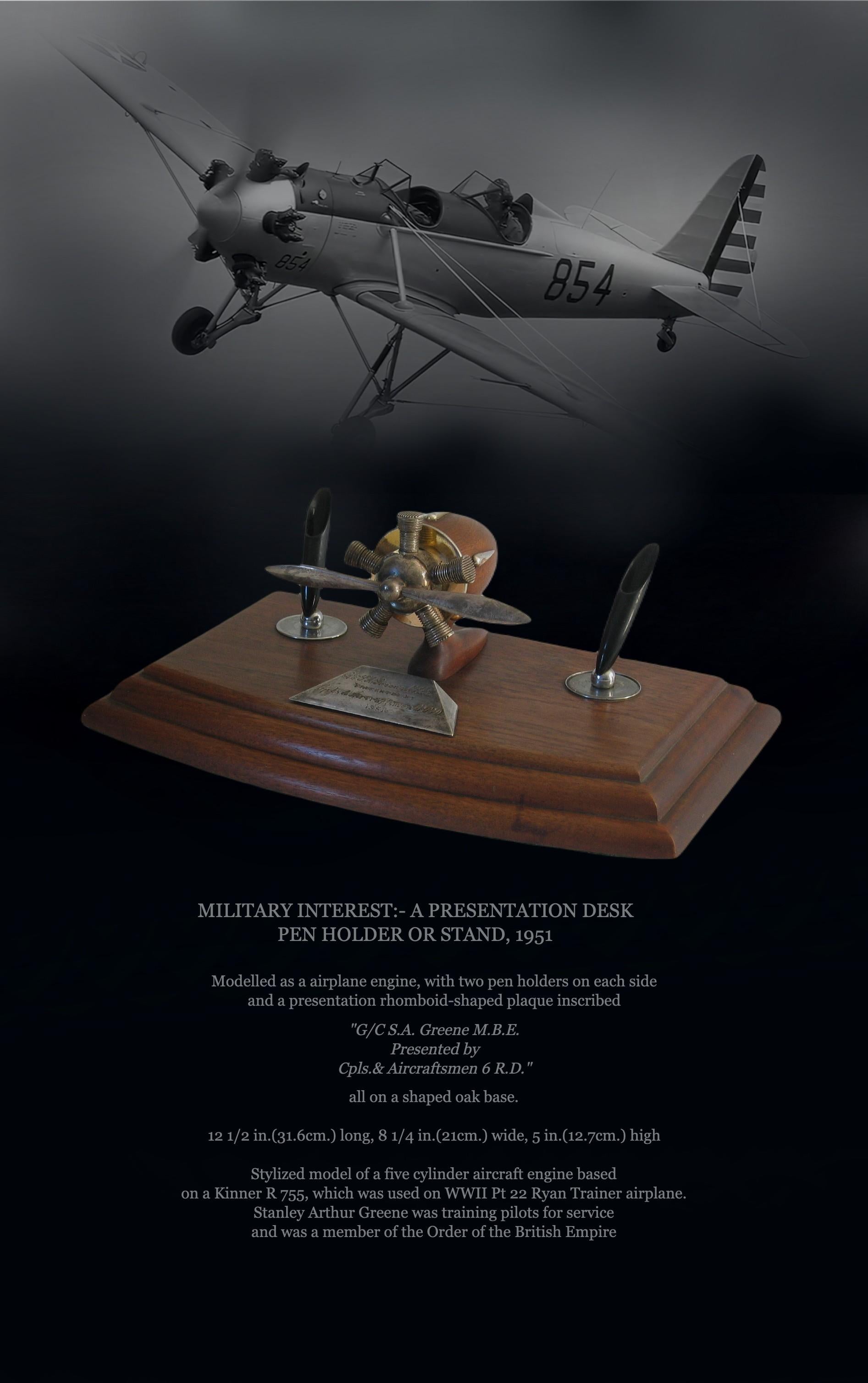 MILITARY INTEREST:- A PRESENTATION DESK
PEN HOLDER OR STAND, 1951

Modelled as a airplane engine, with two pen holders on each side and a presentation rhomboid-shaped plaque inscribed 