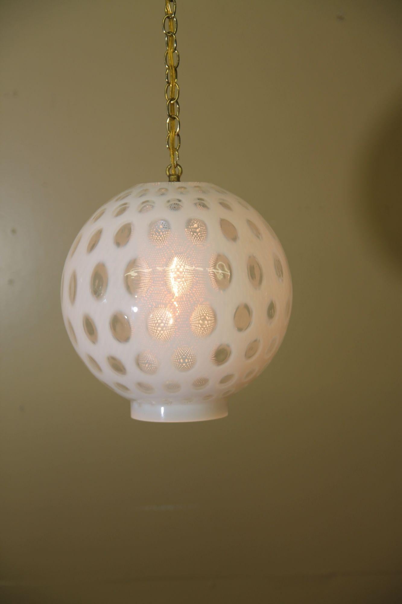 Nice hanging lamp with white and clean glass as well as a white diffuser. This lamps looks great when light is on and also when its not. This would look great in a hall way or over a smaller table.