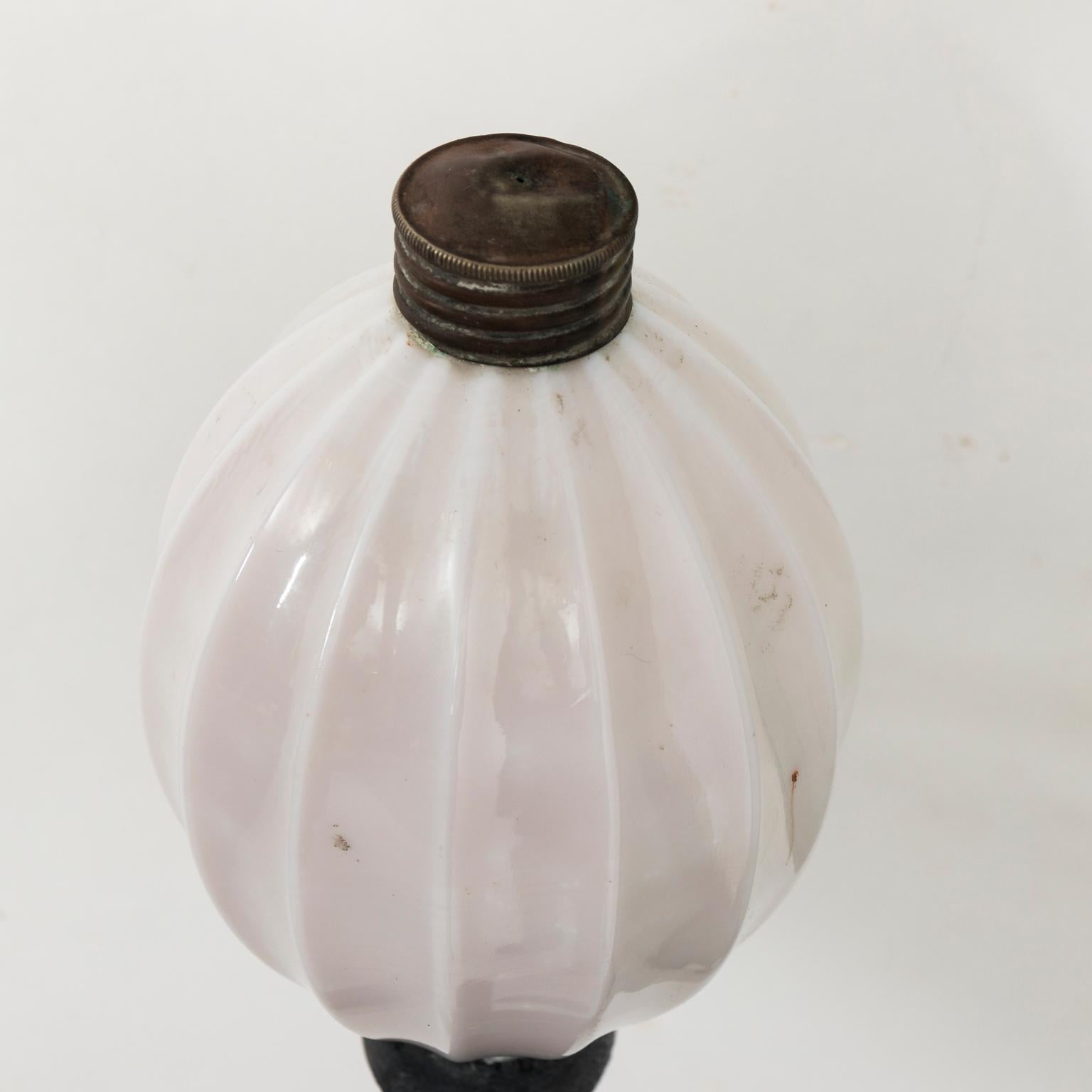 Ribbed milk glass soap dispenser with metal hardware, circa mid-20th century.
   