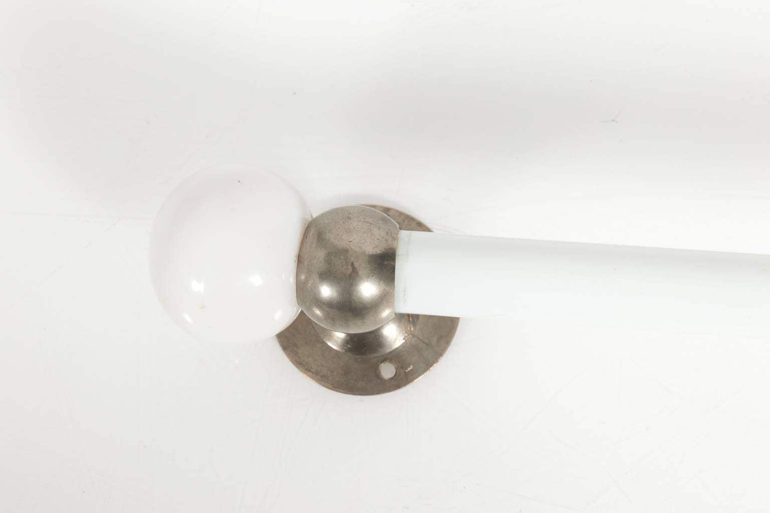 Milk glass towel bar with ball ends by Brasscrafters, circa 1910.
 