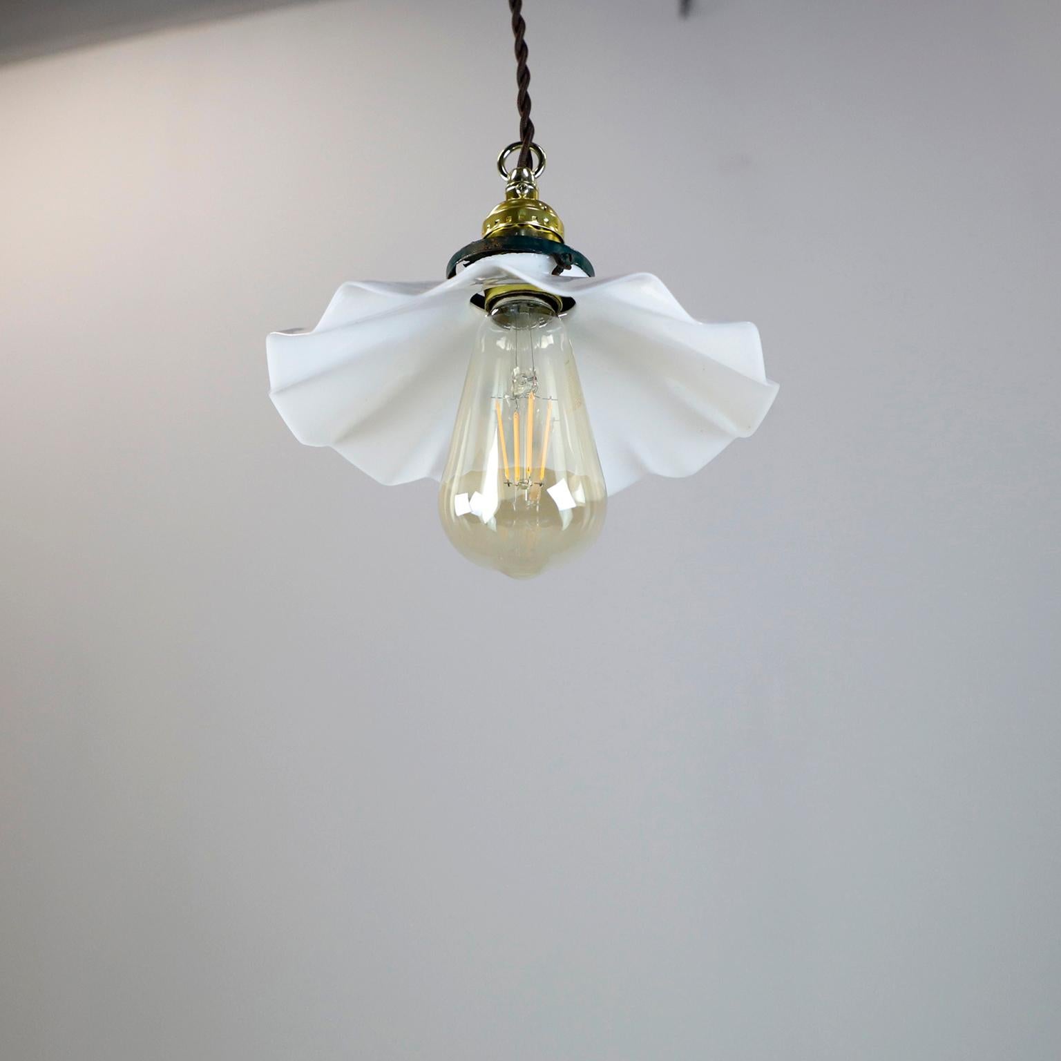 We offer this Milk Glass Vintage Industrial Pendant Light. Glass shade in excellent condition. The electrical system is new and works perfectly.