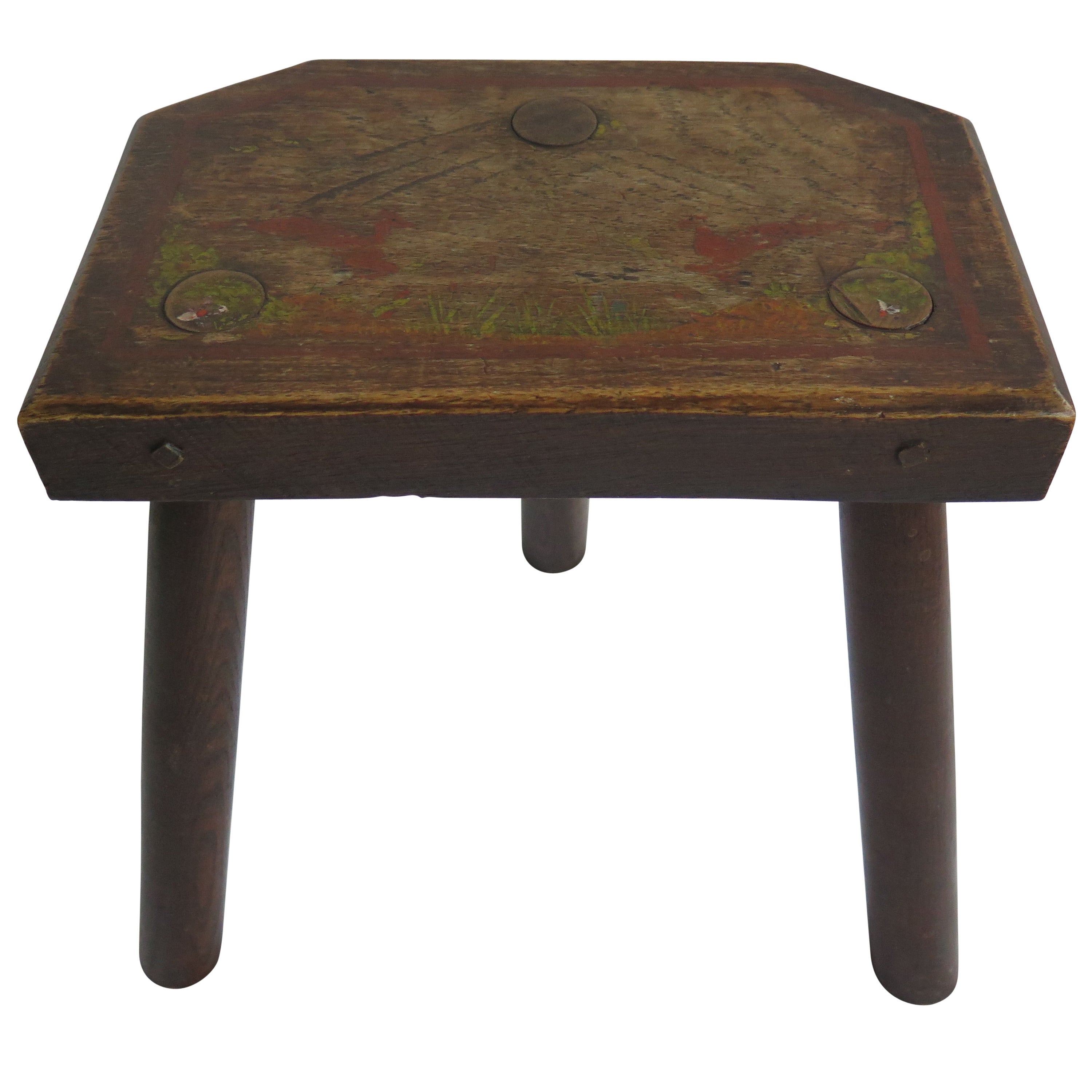 This is a 19th century, English milking stool, with a chamfered rectangular Elm top having a hand painted, Folk Art, country scene on it. It has three turned oak legs that are pegged into the top. 

Original hand painted furniture is rare.

We