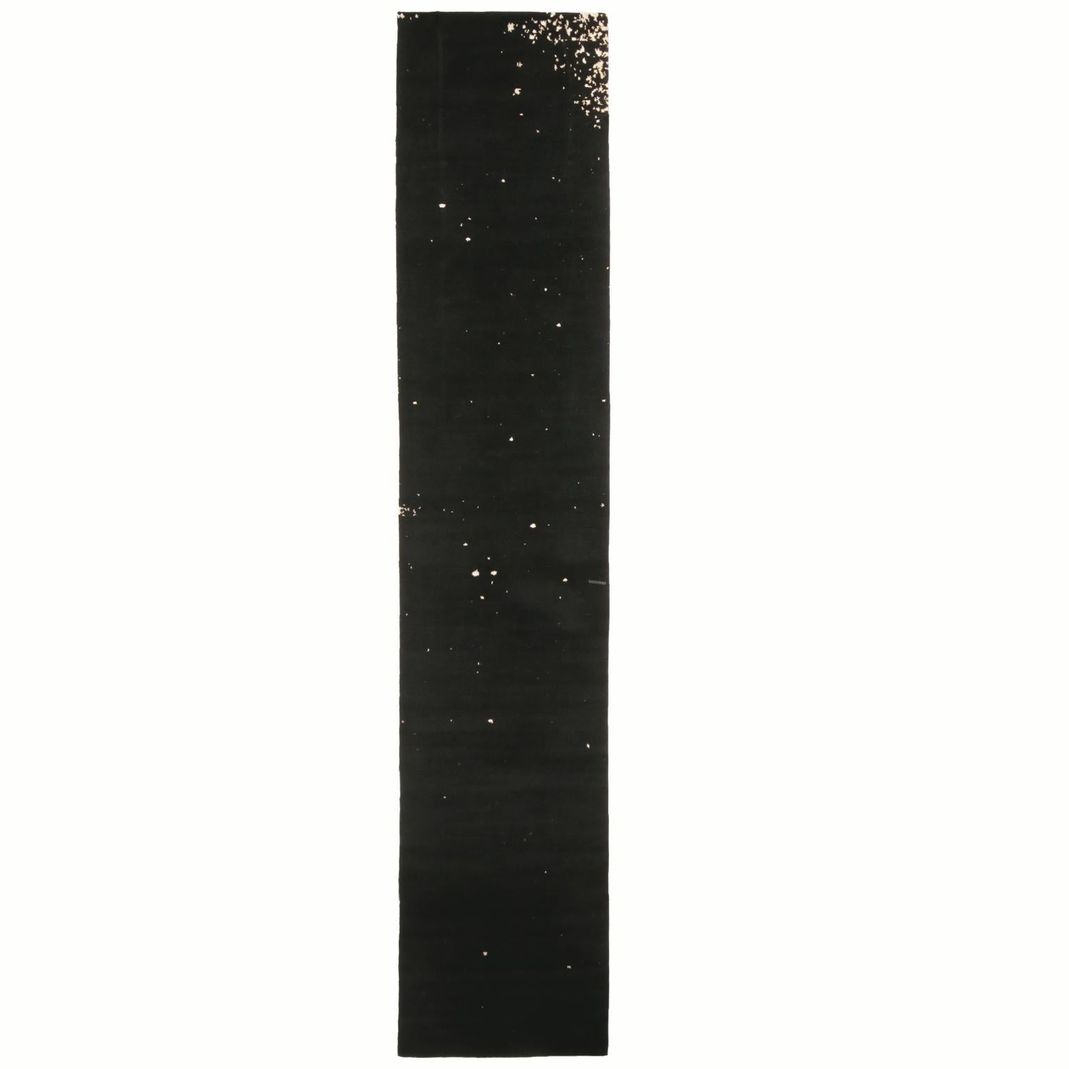 Hand knotted with high quality wool in Nepal, Rug & Kilim’s wool and silk rug from Rug & Kilim is referred to as a Milky Way design, characterized by the monochromatic void black background complemented by a luminous white splash pattern resembling