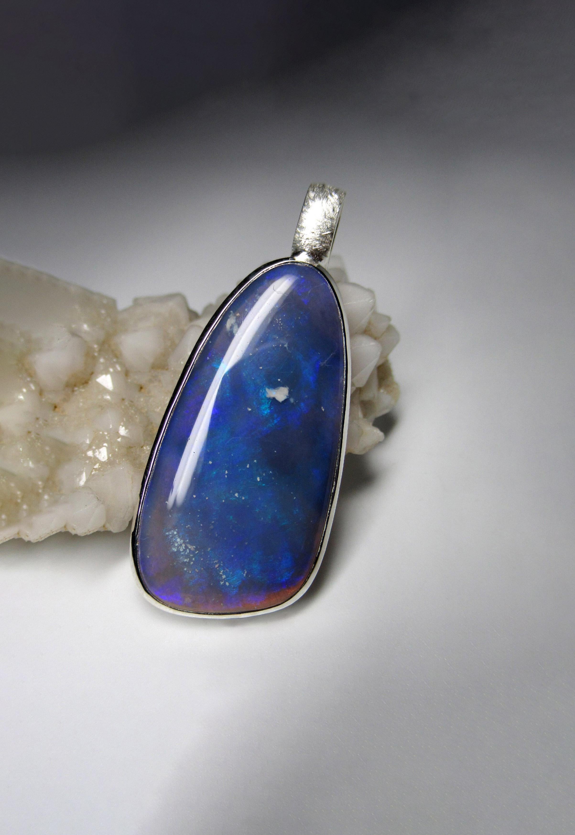 Large unisex Australian Opal pendant in matte finish silver
opal origin - Australia
opal measurements - 0.12 x 0.67 x 1.34 in / 3 x 17 x 34 mm
opal weight - 17.15 carats
pendant length - 1.73 in / 44 mm
pendant weight - 6.59 grams
ref N 11853
The
