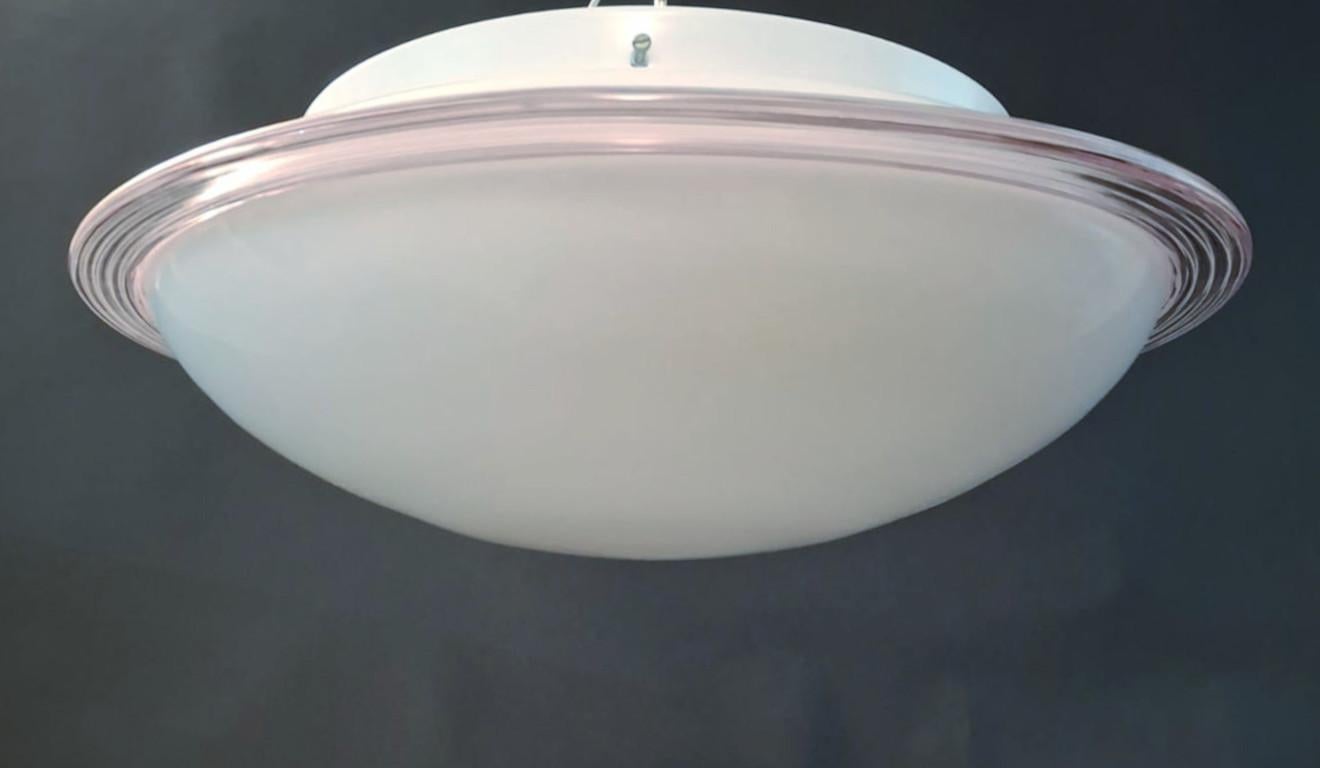 Vintage Italian flush mount or wall light with a single milky white Murano glass shade enclosed in clear border with thin elegant pink rings / Made in Italy in the style of Venini, circa 1960s
Measures: diameter 20 inches, height 7.5 inches
2 lights
