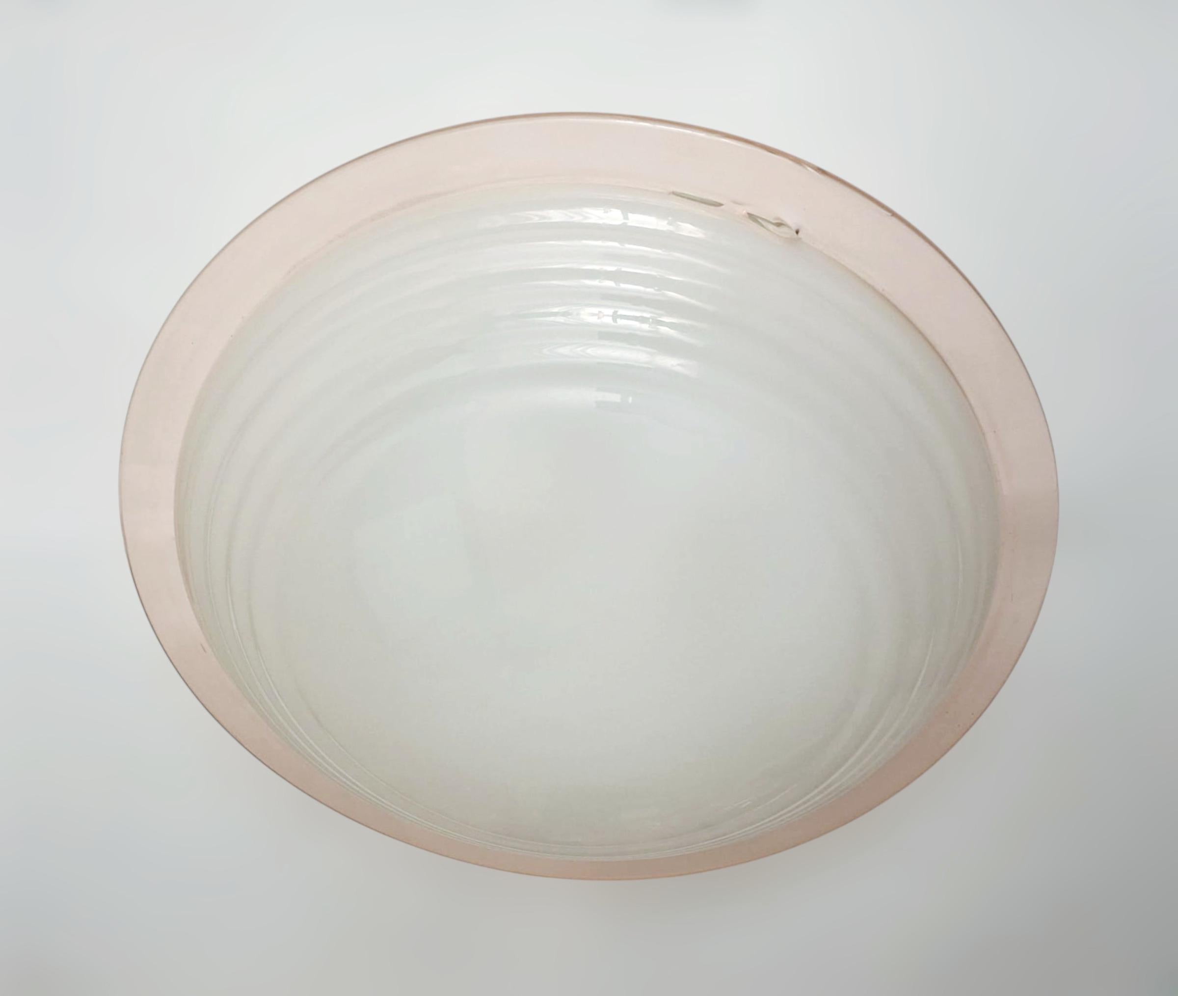 Vintage Italian flush mount or wall light with a frosted textured Murano glass shade enclosed in elegant salmon color border / Made in Italy in the style of Venini, circa 1960s
Measures: diameter 22 inches, height 7 inches
2 lights / E26 or E27 type