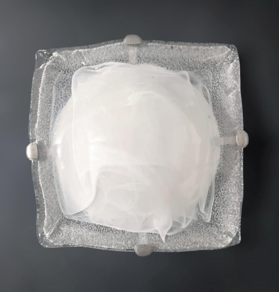 Vintage Italian flush mount or wall light with a single square graniglia Murano glass shade in milky white color / Made in Italy in the style of Mazzega, circa 1960s
Measures: width 12 inches, length 12 inches, height 3.5 inches
1 light / E26 or E27