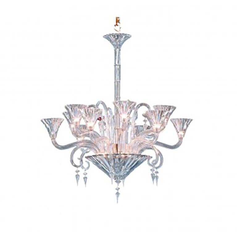 Chandelier entirely in bevelled cut crystal, solid branches, straight and curved scrolls in bevelled cut crystal. The emblematic Baccarat ruby red octagonal tassel hangs amongst the hexagonal and prismatic crystal pieces, it is the Baccarat