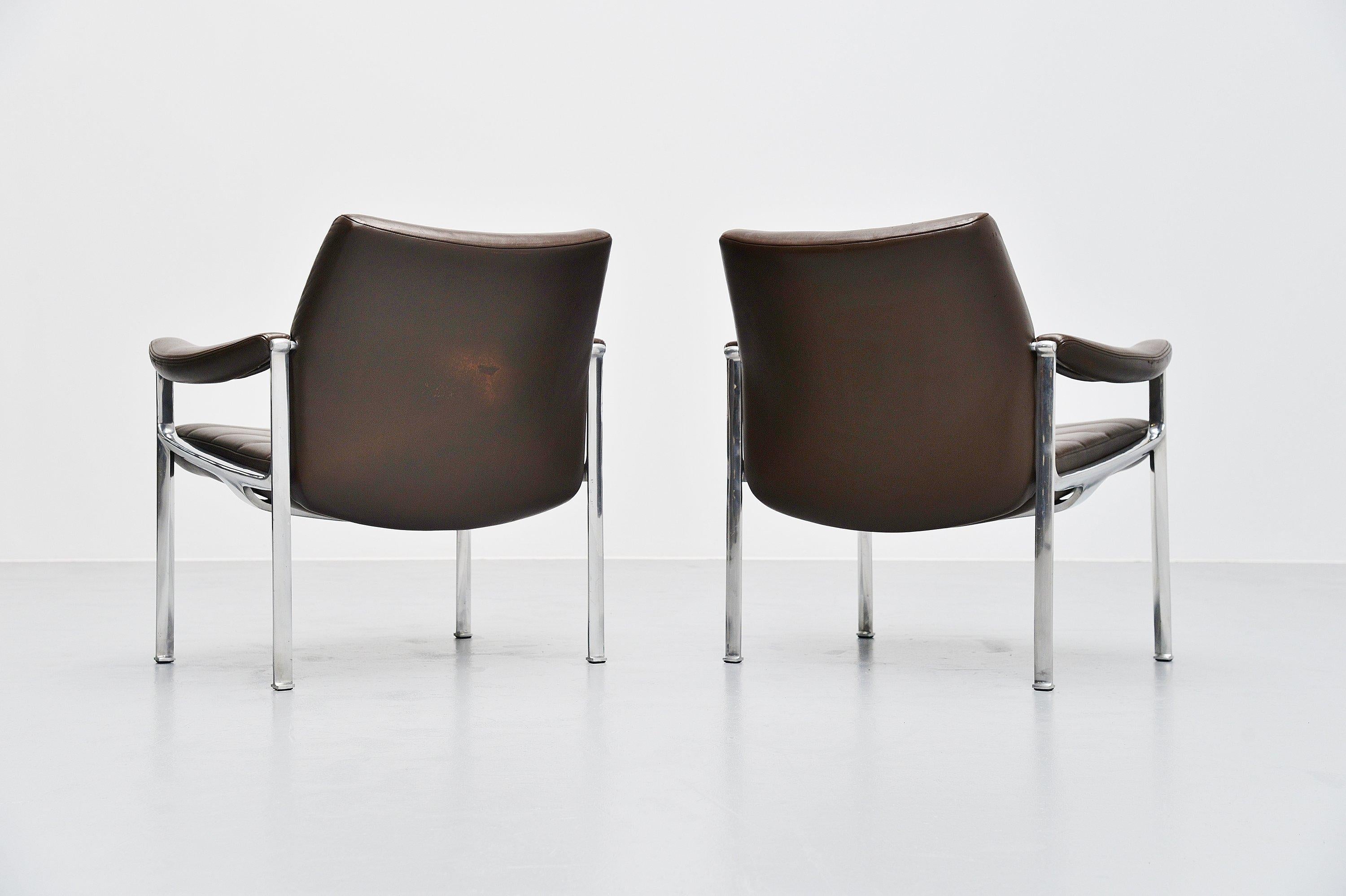 High quality pair of lounge chairs designed by Miller Borgsen and manufactured by Röder Söhne, Germany 1966. The chairs have a solid aluminium frame and brown leather upholstered seats. Very nice details on the frames which are even supporting the