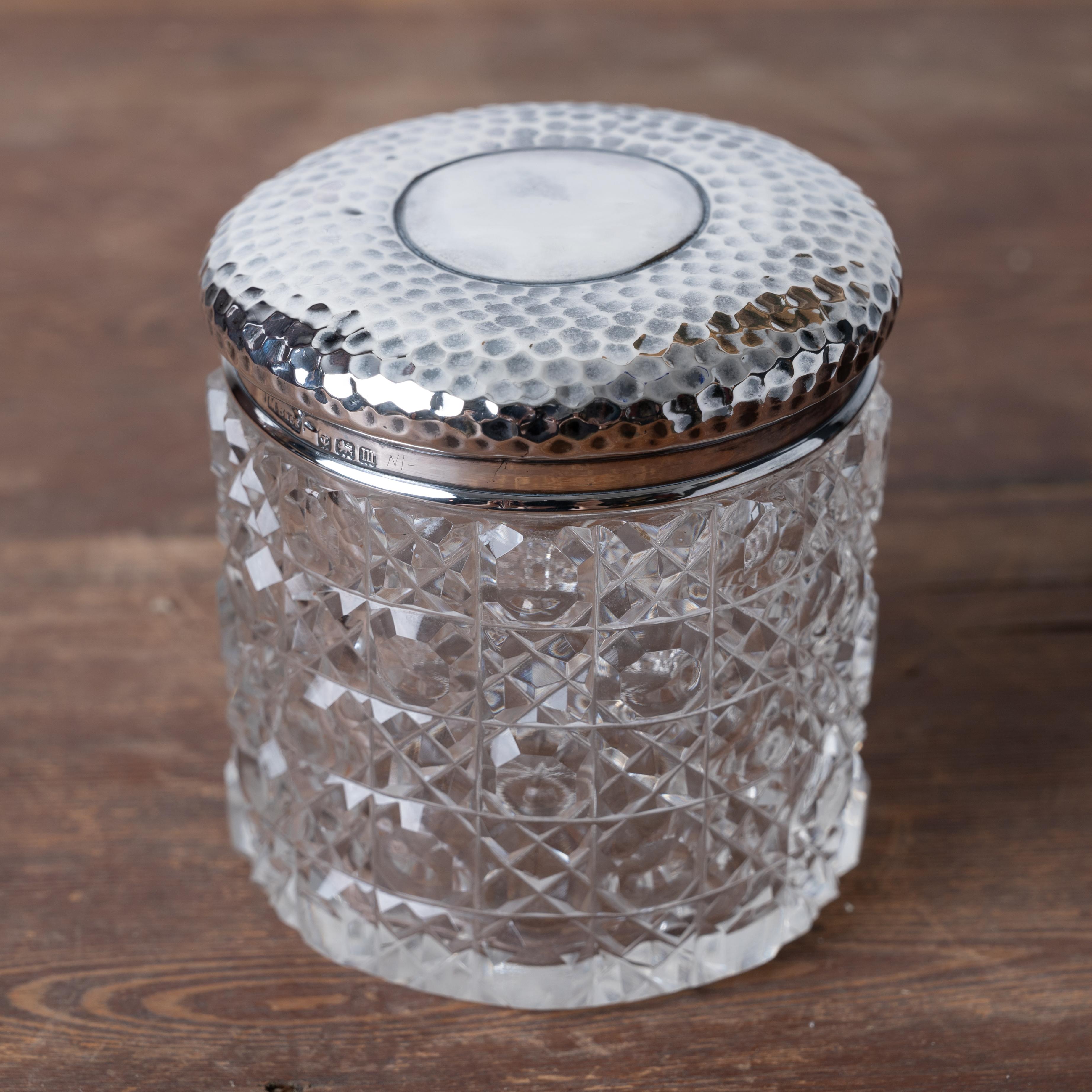 A Miller Bros. cut crystal vanity box, London, dated 1911.

3 inches wide by 3 inches tall



