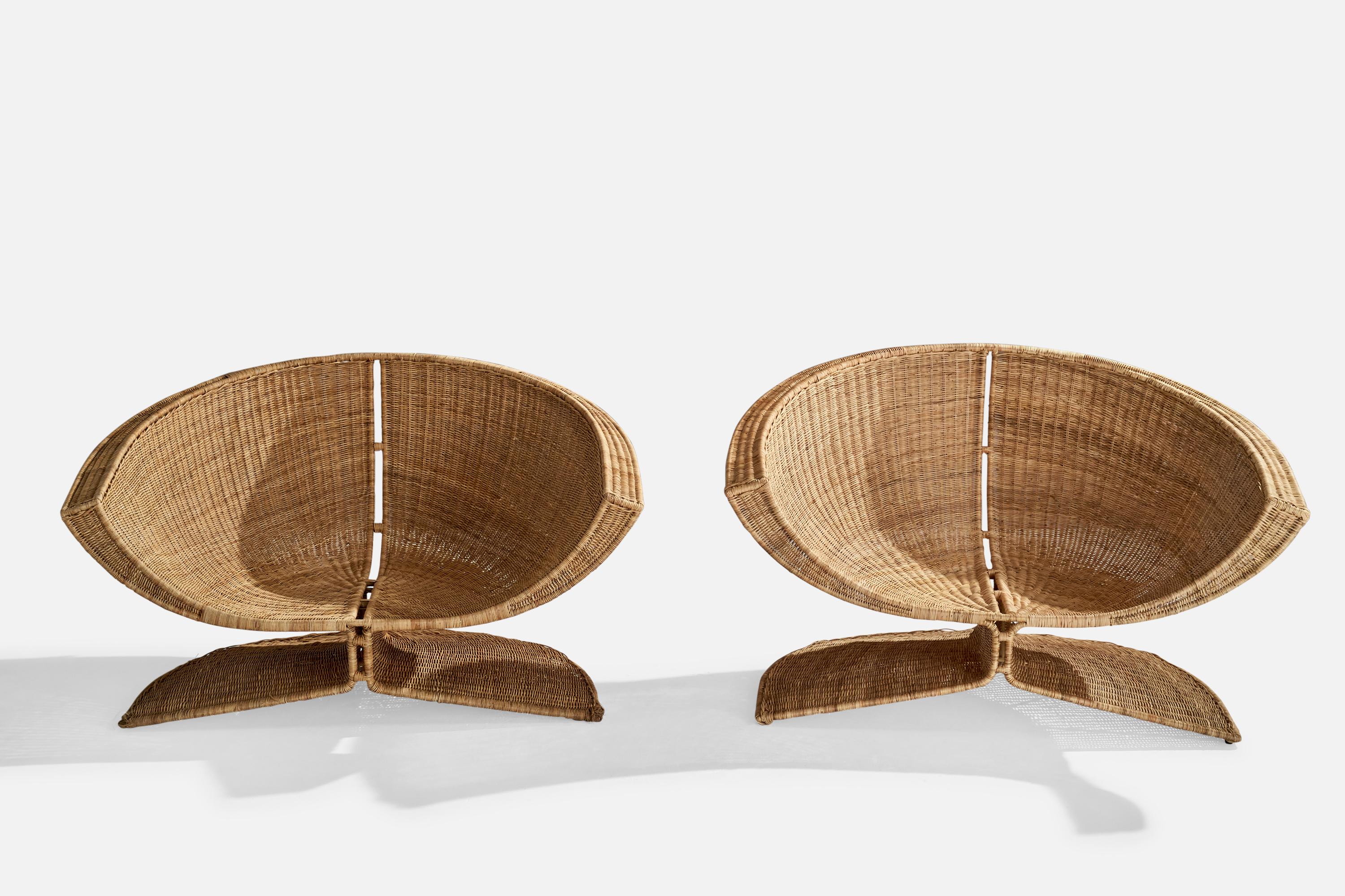 A pair of wicker over stainless steel lounge chairs designed by Miller Fong and produced by Tropi-Cal, USA, c. 1966.



