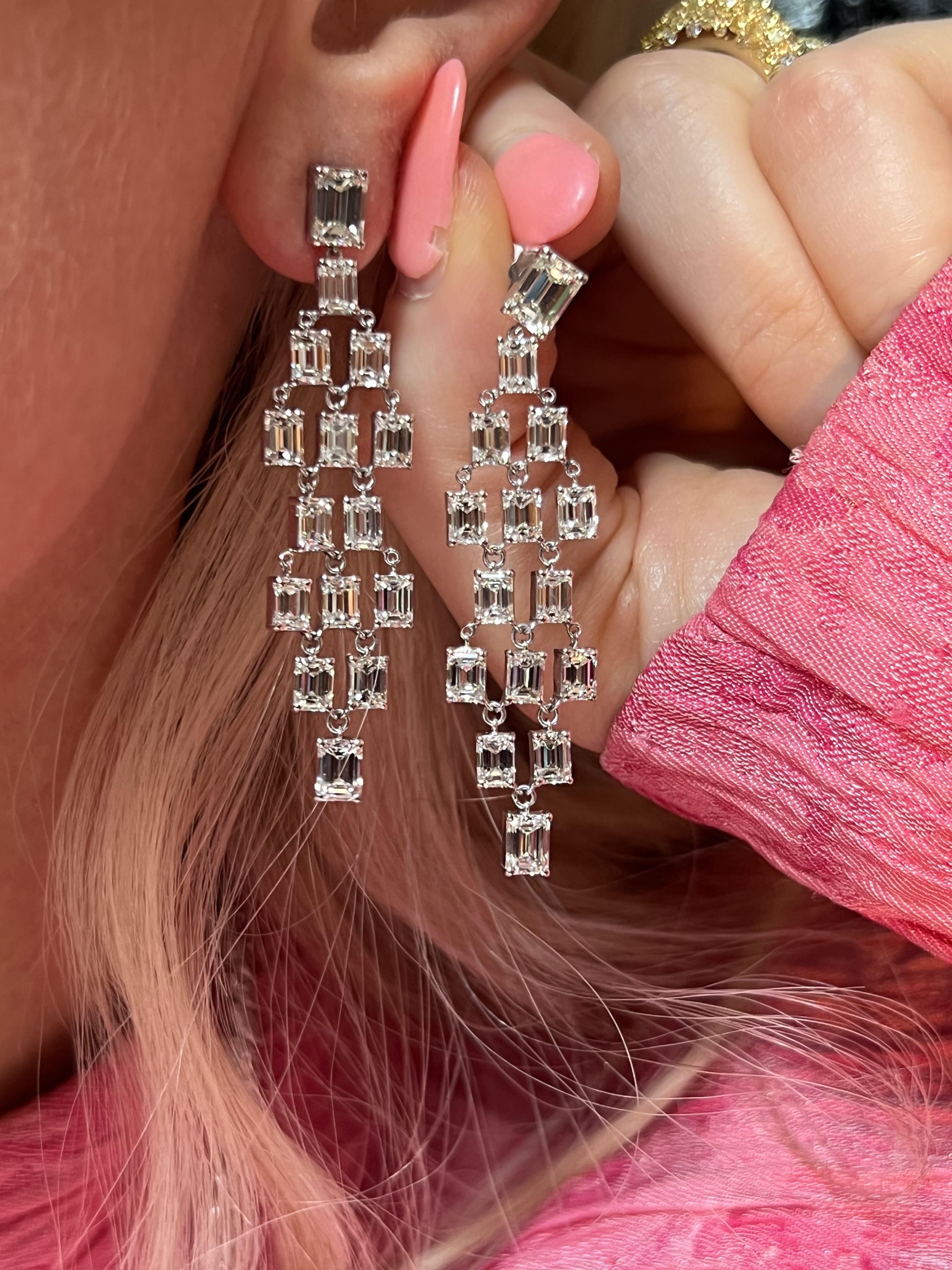 Indulge in the timeless elegance of these exquisite 18k white gold diamond earrings, designed to add a touch of luxury to any outfit. Each earring sparkles with the brilliance of 30 natural diamonds, perfectly set to catch the light. A perfect blend