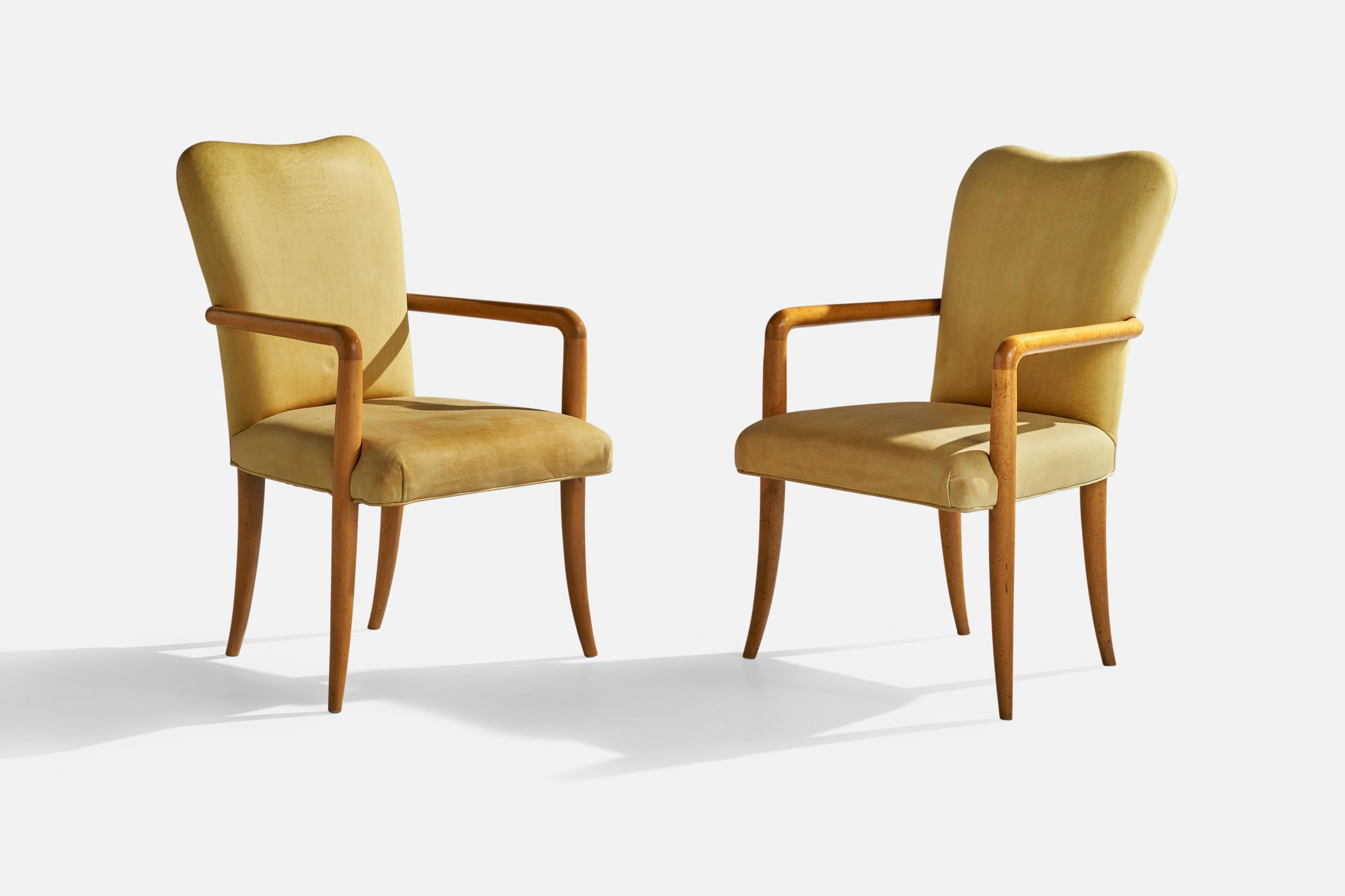 A pair of wood and yellow beige leather armchairs designed and produced by Milling Road, USA, 1990s.

Seat height 19”