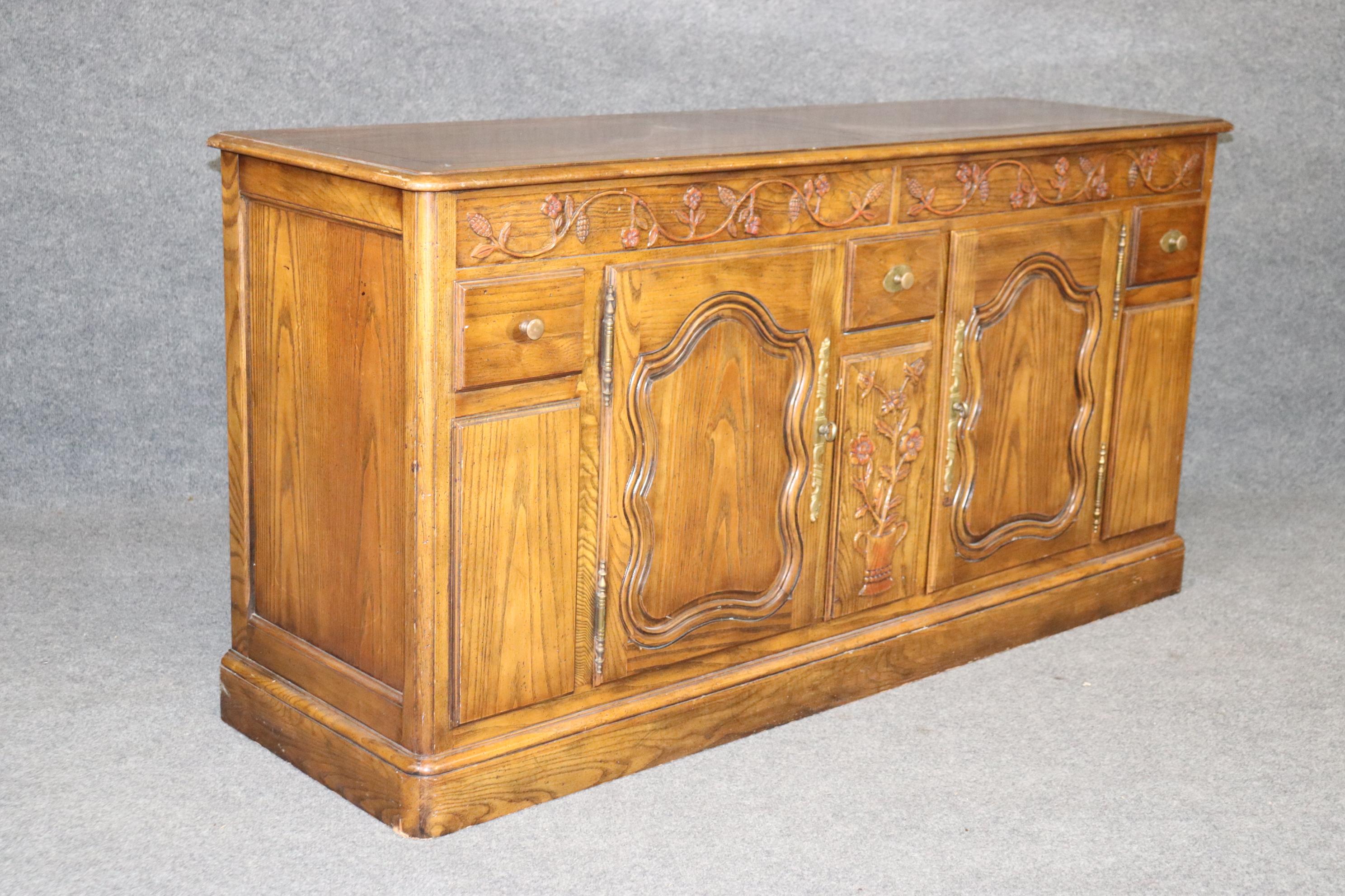 French Provincial Milling Road by Baker Furniture Country French Oak Sideboard Buffet, circa 1980 For Sale