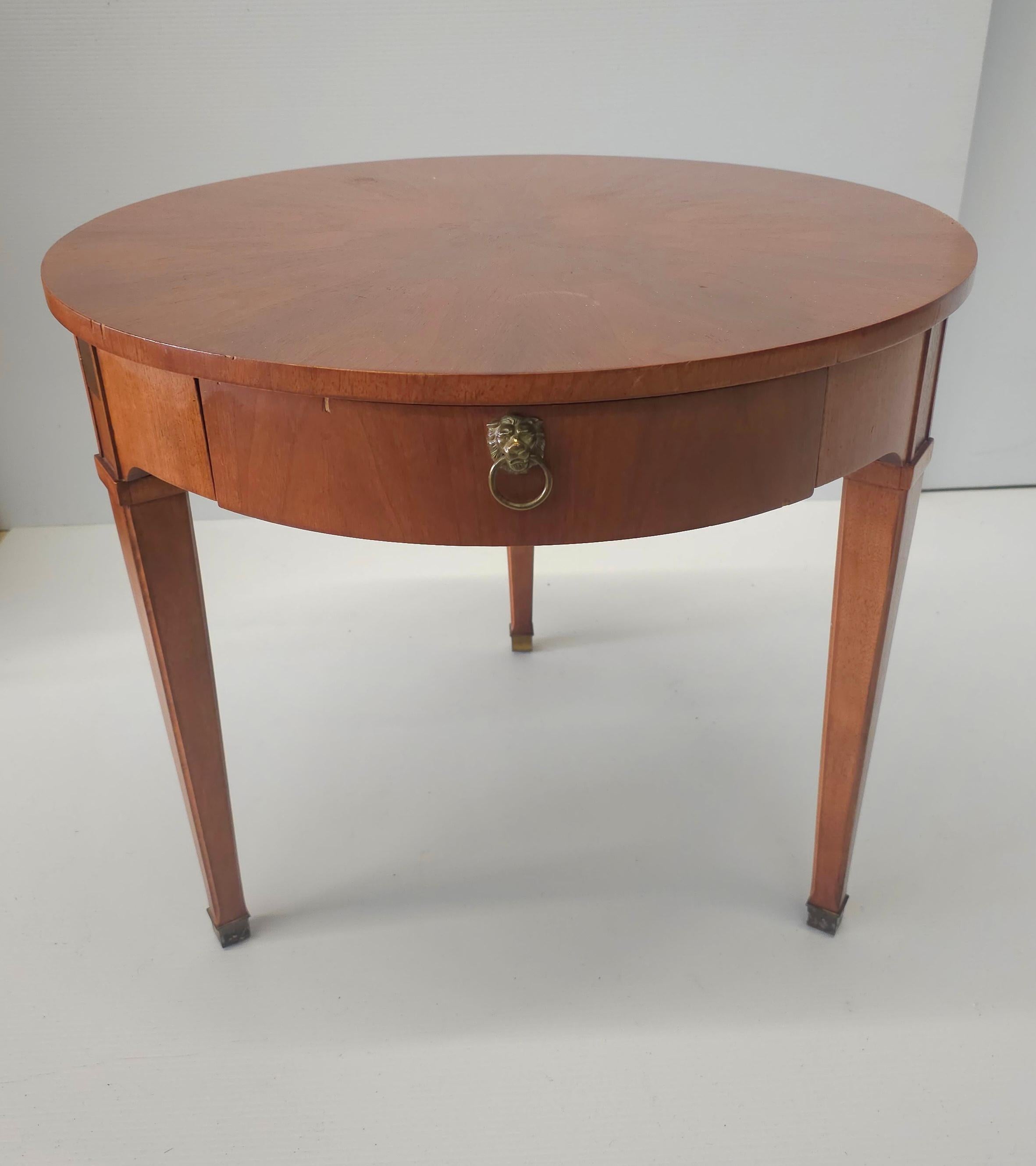 A Milling Road By Baker Furniture Mahogany and Brass Fittings Side Table. Brass capped legs. Measures 25